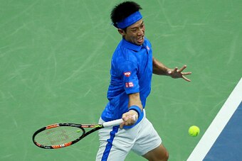 NEW YORK, NY - SEPTEMBER 07:  Kei Nishikori of Japan returns a shot to Andy Murray of Great Britain during their Men's Singles Quarterfinal match on Day Ten of the 2016 US Open at the USTA Billie Jean King National Tennis Center on September 7, 2016 in th