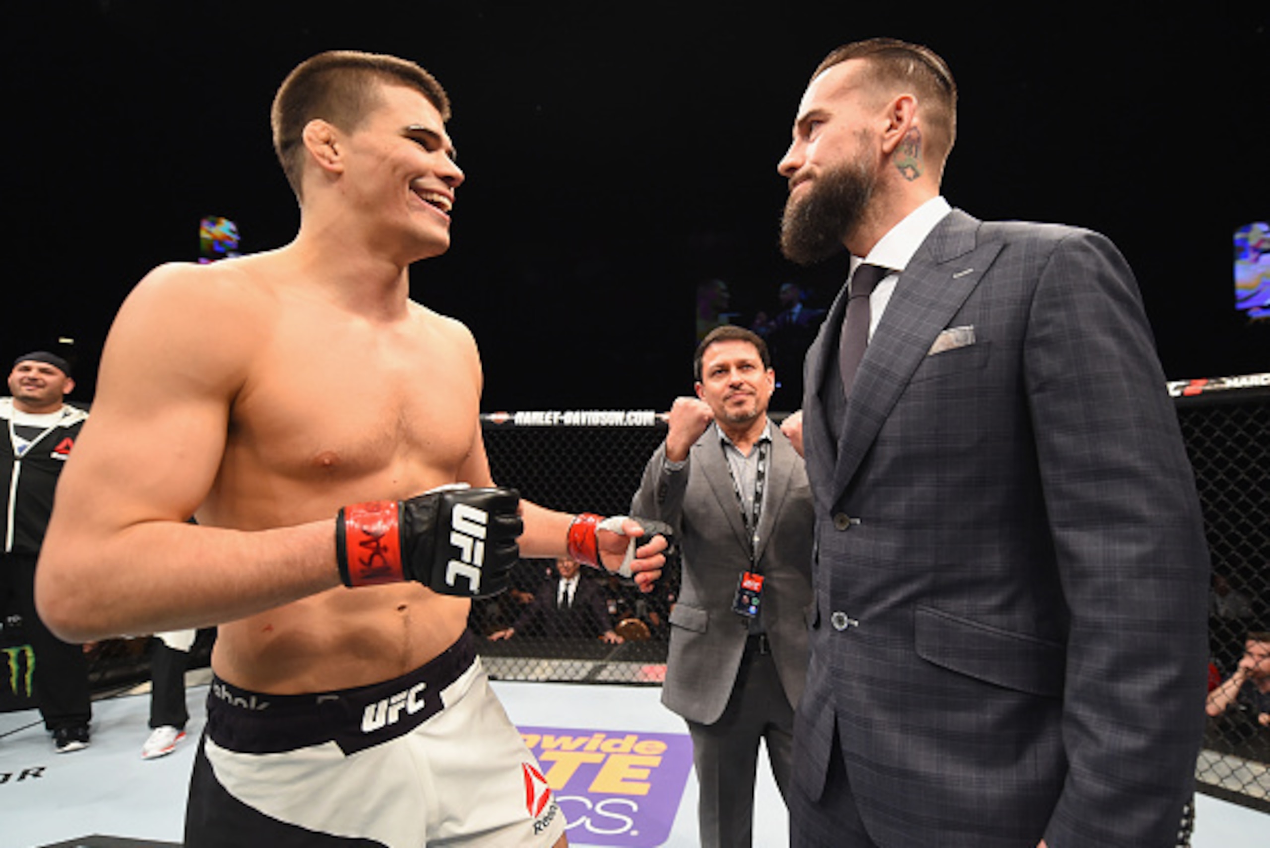 LAS VEGAS, NV - FEBRUARY 06:  (R-L) Phil 'CM Punk' Brooks faces off with Mickey Gall after Gall's victory over Mike Jackson during the UFC Fight Night event at MGM Grand Garden Arena on February 6, 2016 in Las Vegas, Nevada.  (Photo by Jeff Bottari/Zuffa 