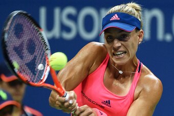 Angelique Kerber of Germany hits a return against Caroline Wozniacki of Denmark during their 2016 US Open Womens Singles semifinal match at the USTA Billie Jean King National Tennis Center in New York on September 8, 2016. / AFP / Timothy A. CLARY        