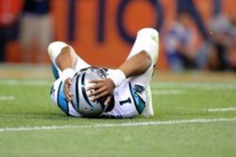Sep 8, 2016; Denver, CO, USA; Carolina Panthers quarterback Cam Newton (1) reacts in pain after suffering an injury in the third quarter against the Denver Broncos at Sports Authority Field at Mile High. Mandatory Credit: Mark J. Rebilas-USA TODAY Sports