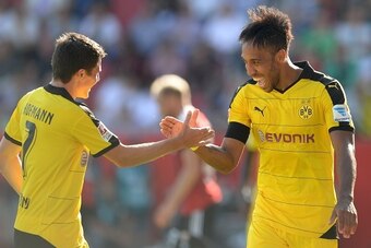 (L-R) Dortmund's midfielder Jonas Hofmann and Dortmund's Gabonese striker Pierre-Emerick Aubameyang celebrate after the fourth goal for Dortmund during the German first division Bundesliga match between FC Ingolstadt and Borussia Dortmund in the stadium i