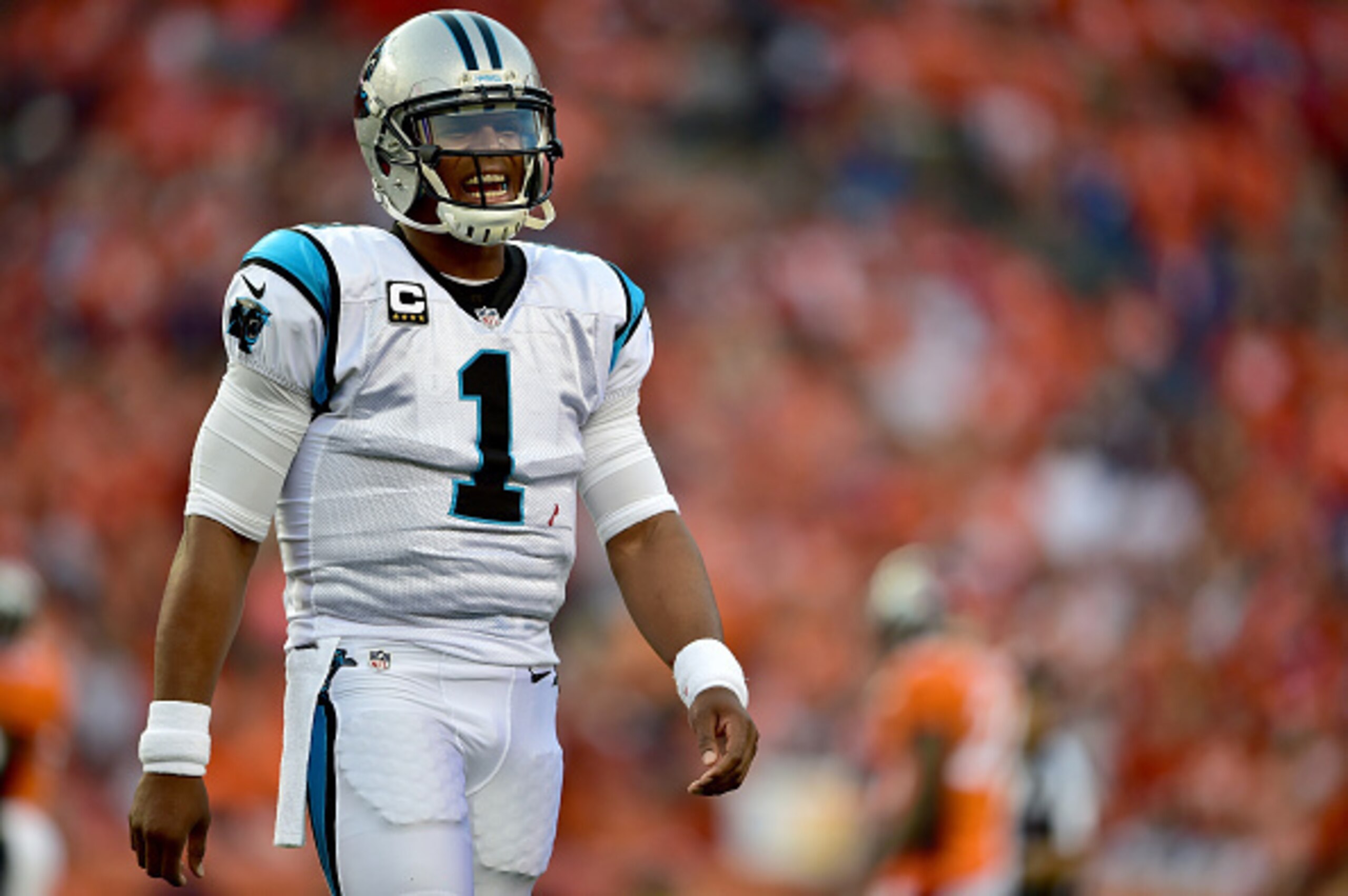 DENVER, CO - SEPTEMBER 08:  Quarterback Cam Newton #1 of the Carolina Panthers smiles in the first quarter against the Denver Broncos at Sports Authority Field at Mile High on September 8, 2016 in Denver, Colorado.  (Photo by Dustin Bradford/Getty Images)