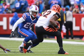 ORCHARD PARK, NY - OCTOBER 18:  Ronald Darby #28 of the Buffalo Bills makes a play on Jeremy Hill #32 of the Cincinnati Bengals during game action at Ralph Wilson Stadium on October 18, 2015 in Orchard Park, New York. (Photo by Jerome Davis/Getty Images)