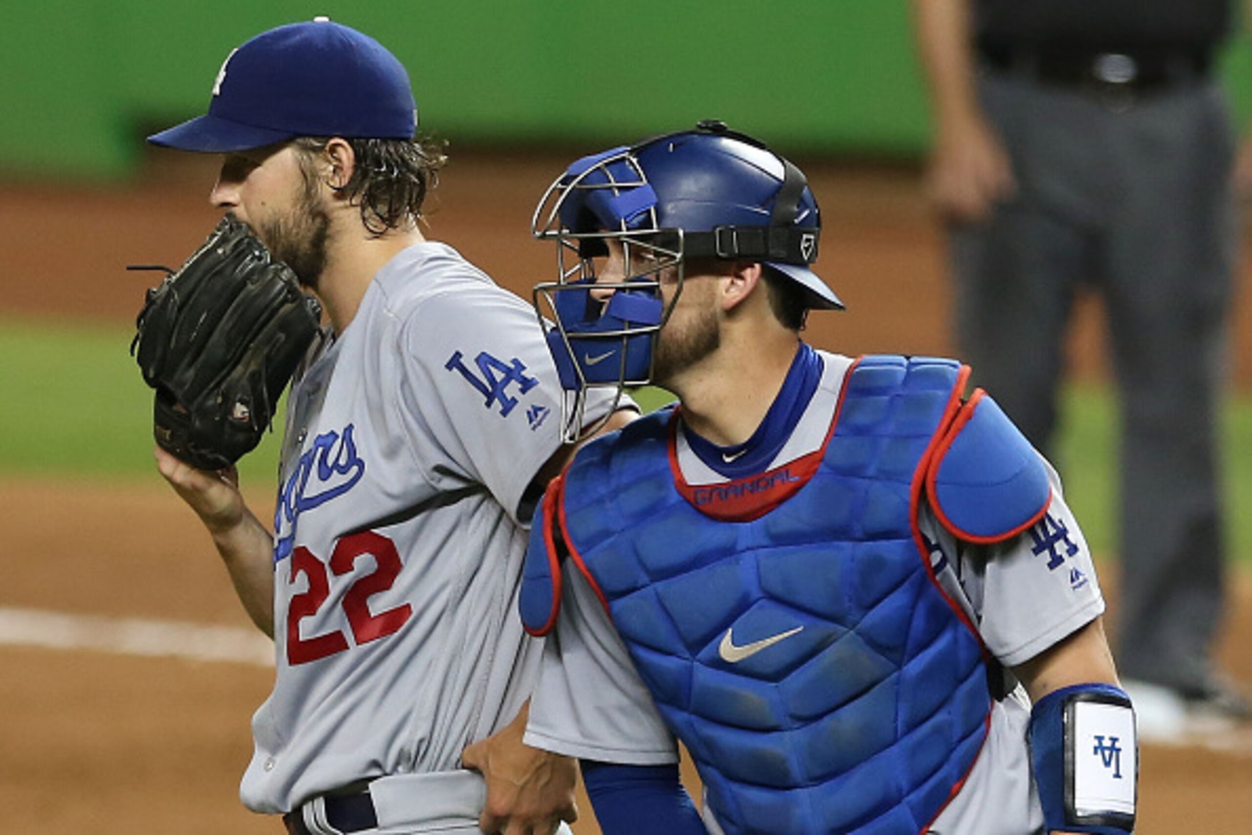 MIAMI , FL - SEPTEMBER 09: Pitcher Clayton Kershaw #22 of the Los Angeles Dodgers againschats with Catcher Yasmani Grandal #9 after giving up a first inning Home Run against the Miami Marlins at Marlin Park on September 9, 2016 in Miami, Florida. (Phot MIAMI , FL - SEPTEMBER 09: Pitcher Clayton Kershaw #22 of the Los Angeles Dodgers againschats with Catcher Yasmani Grandal #9 after giving up a first inning Home Run against the Miami Marlins at Marlin Park on September 9, 2016 in Miami, Florida. (Phot