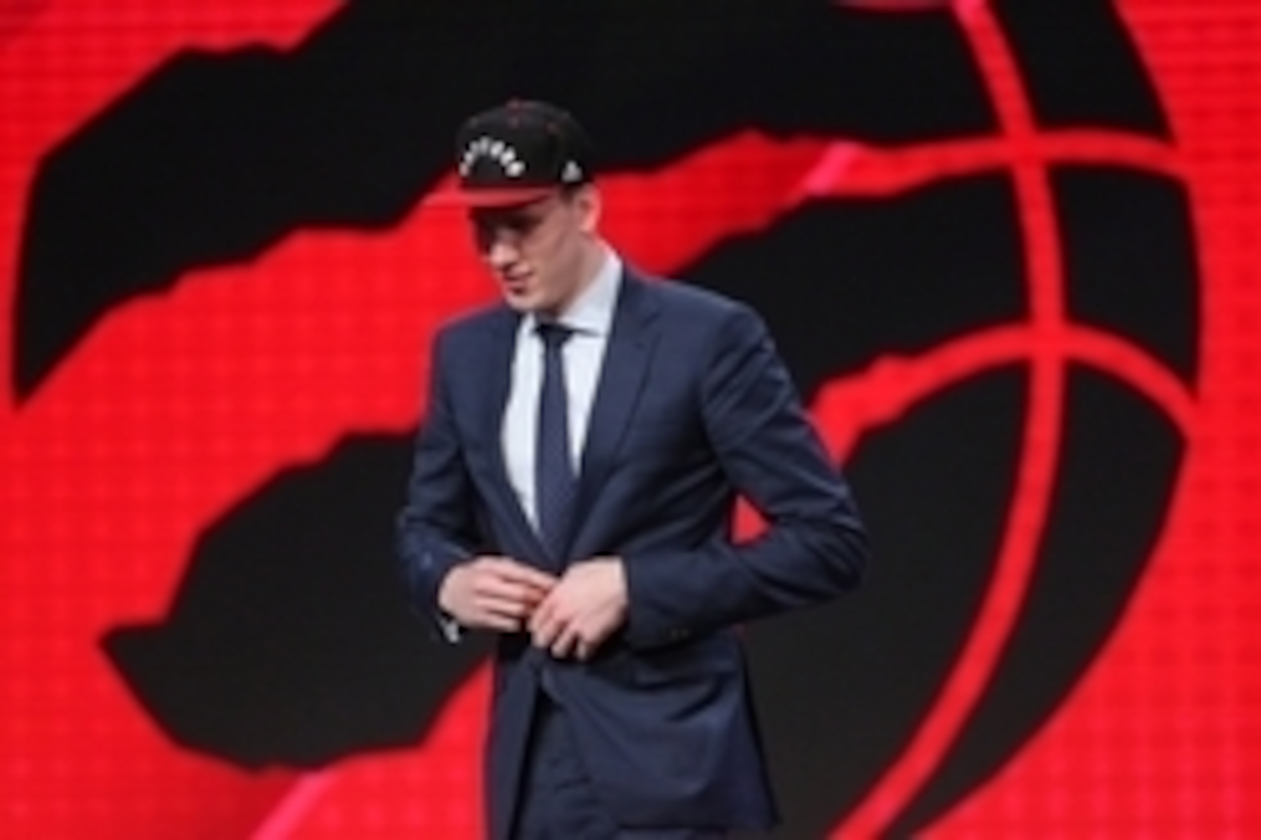 Jun 23, 2016; New York, NY, USA; Jakob Poeltl (Utah) walks off stage after being selected as the number nine overall pick to the Toronto Raptors in the first round of the 2016 NBA Draft at Barclays Center. Mandatory Credit: Brad Penner-USA TODAY Sports