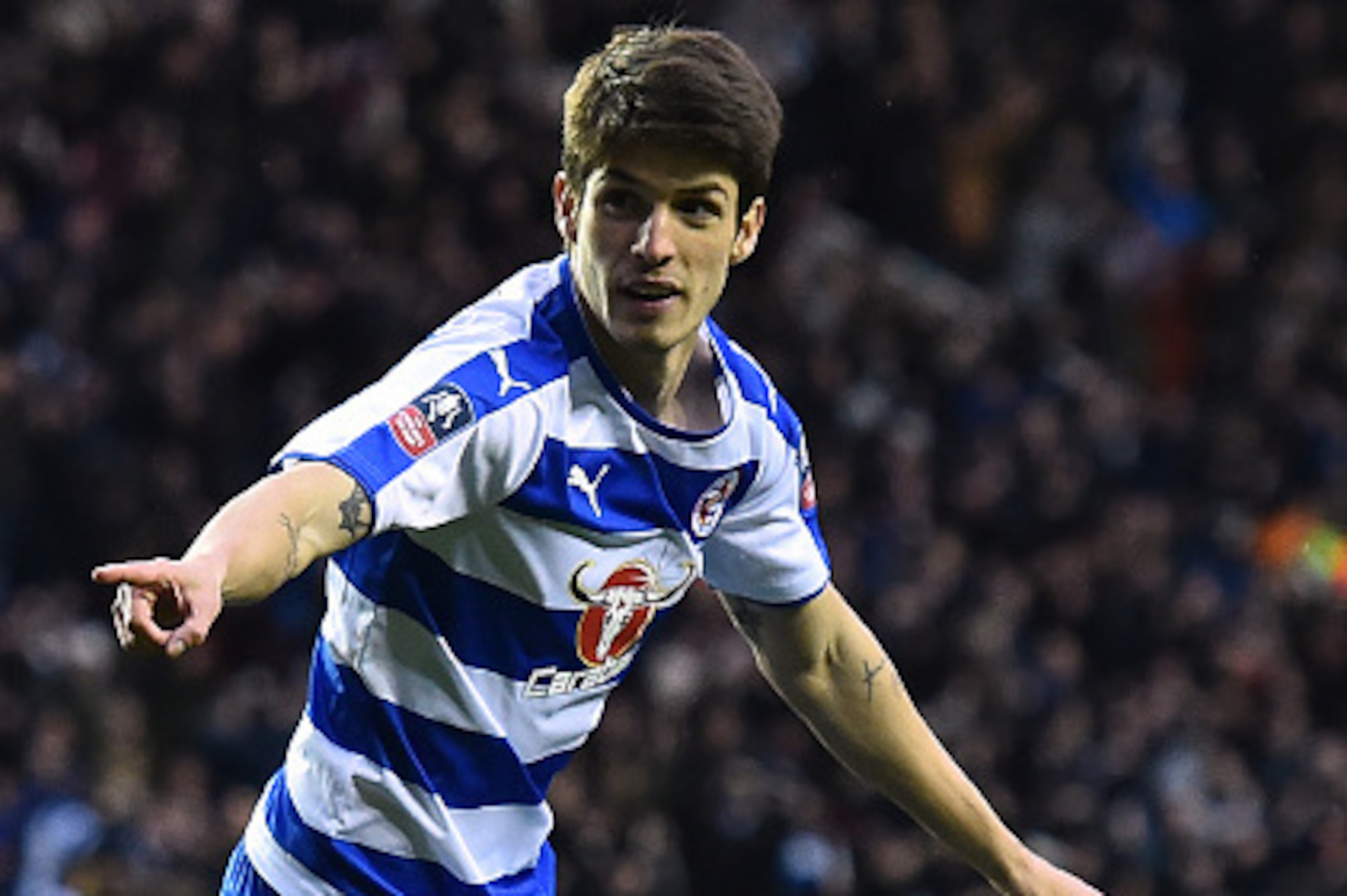 Reading's Brazilian midfielder Lucas Piazon celebrates after scoring their third goal during the FA cup fifth round football match between Reading and West Bromwich Albion at Madejski stadium in Reading on February 20, 2016.  / AFP / BEN STANSALL / RESTRI