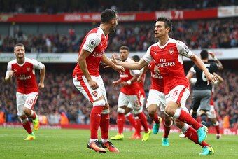 LONDON, ENGLAND - SEPTEMBER 10:  Laurent Koscielny of Arsenal celebrates scoring his sides first goal with his team mates during the Premier League match between Arsenal and Southampton at Emirates Stadium on September 10, 2016 in London, England.  (Photo