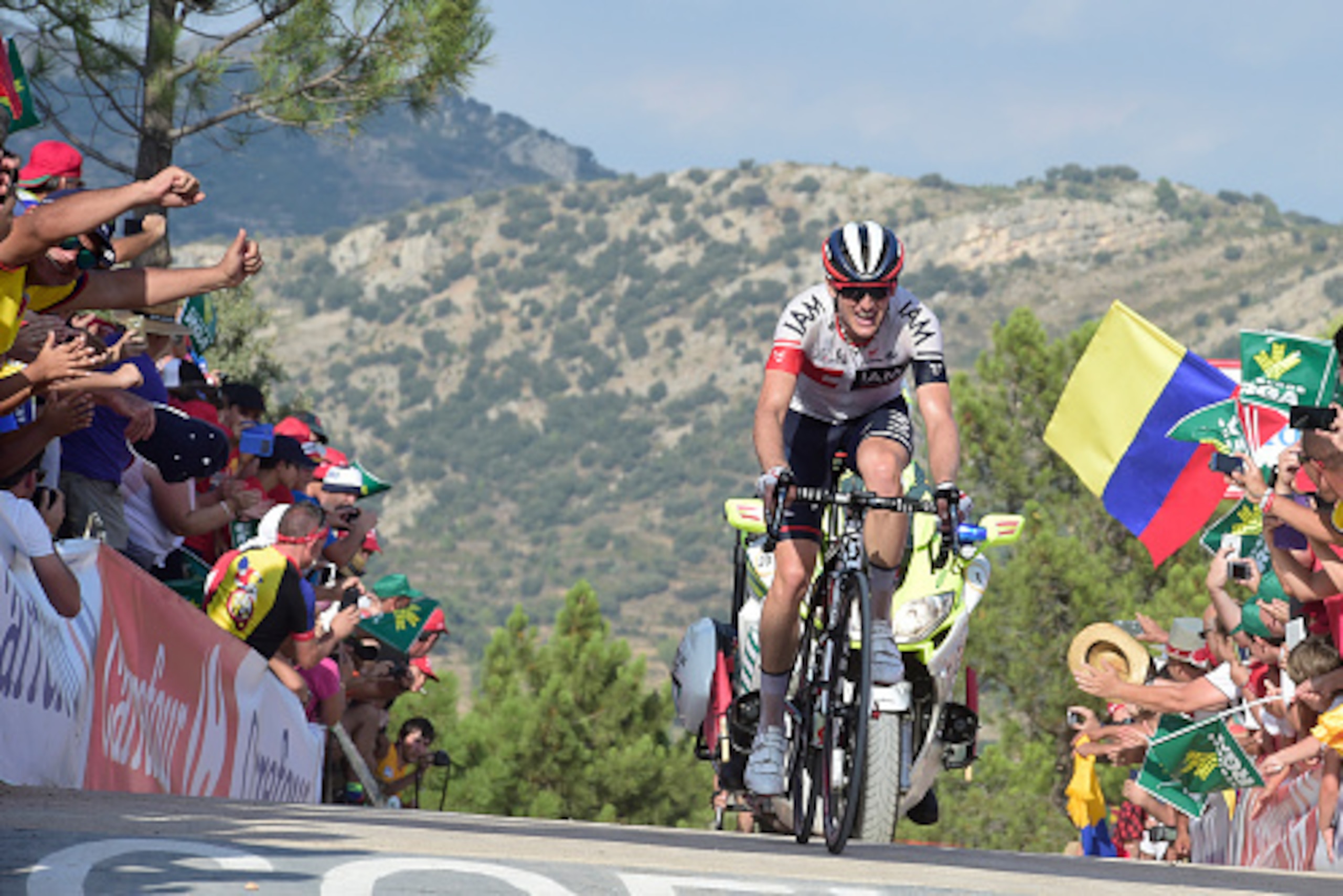 Iam's Swiss cyclist Mathias Frank  crosses the finish line to win the 17th stage of the 71st edition of 'La Vuelta' Tour of Spain, a 173.3km route Castellon to Llucena, on September 7, 2016. / AFP / JOSE JORDAN        (Photo credit should read JOSE JORDAN