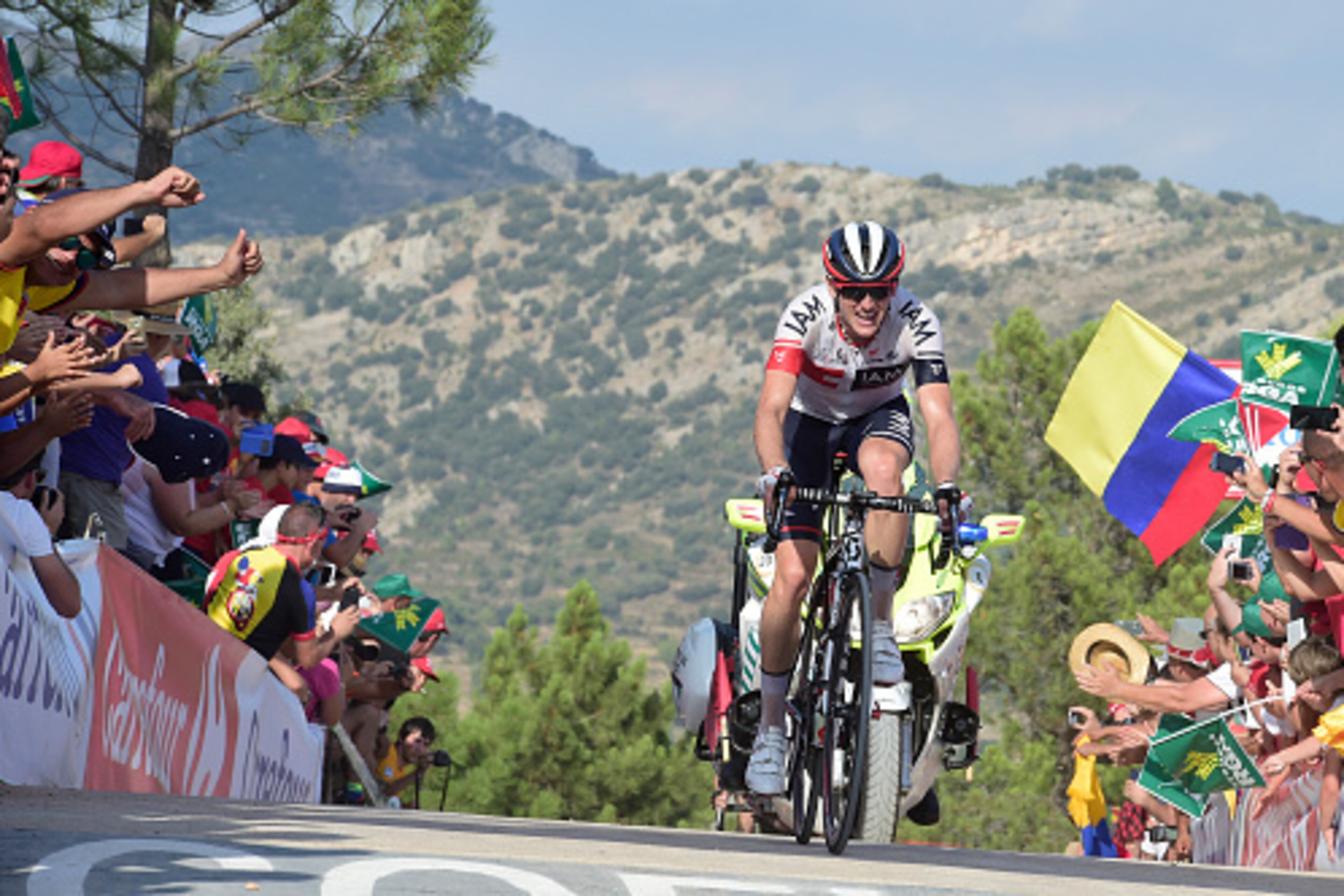 Iam's Swiss cyclist Mathias Frank  crosses the finish line to win the 17th stage of the 71st edition of 'La Vuelta' Tour of Spain, a 173.3km route Castellon to Llucena, on September 7, 2016. / AFP / JOSE JORDAN        (Photo credit should read JOSE JORDAN