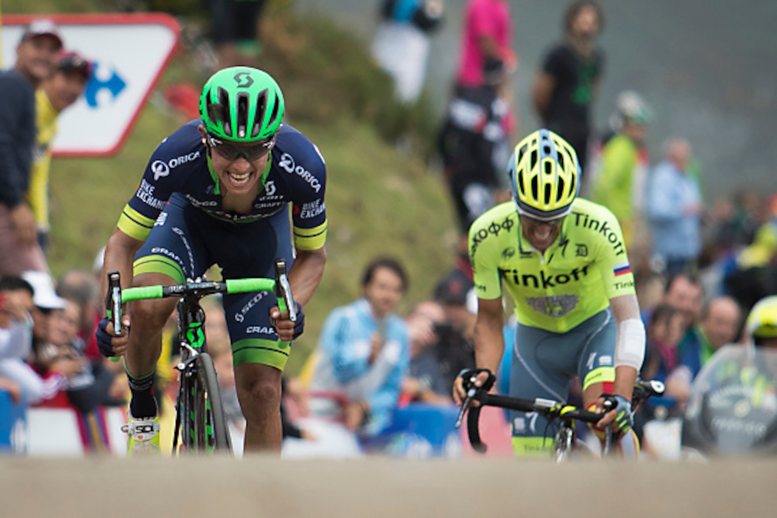 Orica-Bikeexchange Colombian cyclist Esteban Chaves (L) and Tinkoff's Spanish cyclist Alberto Contador arrive at the finish line during the 10th stage of the 71st edition of 'La Vuelta' Tour of Spain, a 188,7km route between Lugones to Lagos de Covadonga 