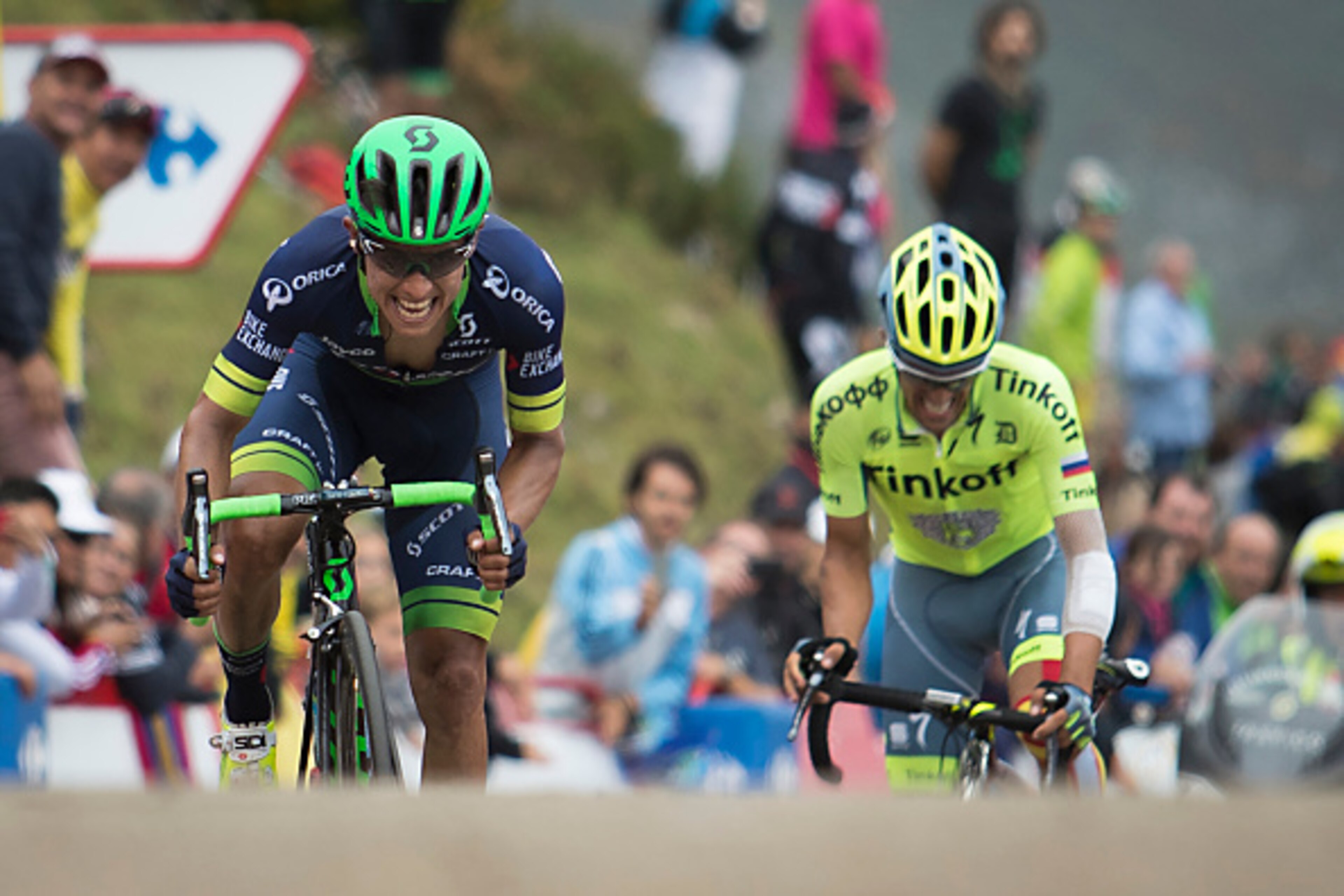 Orica-Bikeexchange Colombian cyclist Esteban Chaves (L) and Tinkoff's Spanish cyclist Alberto Contador arrive at the finish line during the 10th stage of the 71st edition of 'La Vuelta' Tour of Spain, a 188,7km route between Lugones to Lagos de Covadonga 