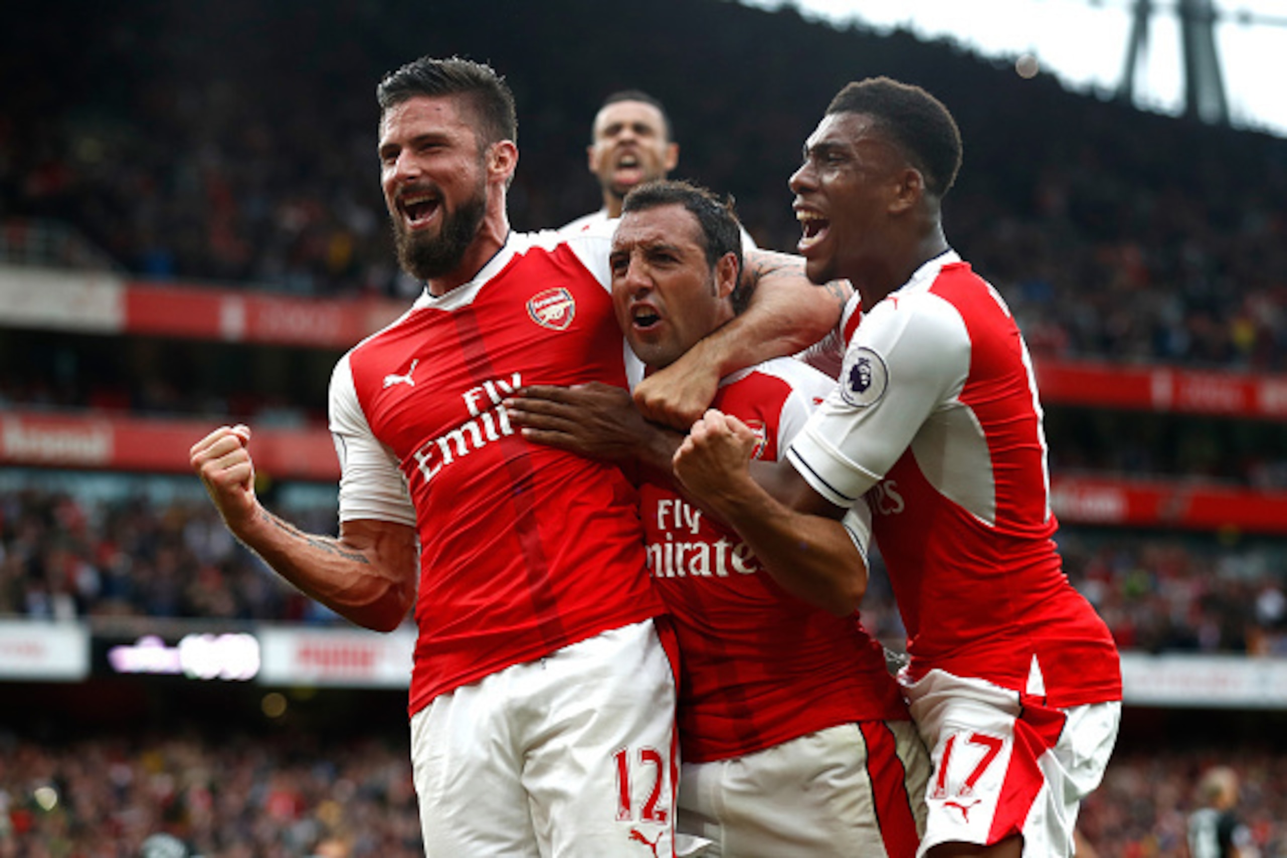 LONDON, ENGLAND - SEPTEMBER 10:  Santi Cazorla of Arsenal celebrates scoring his sides second goal with his team mates during the Premier League match between Arsenal and Southampton at Emirates Stadium on September 10, 2016 in London, England.  (Photo by