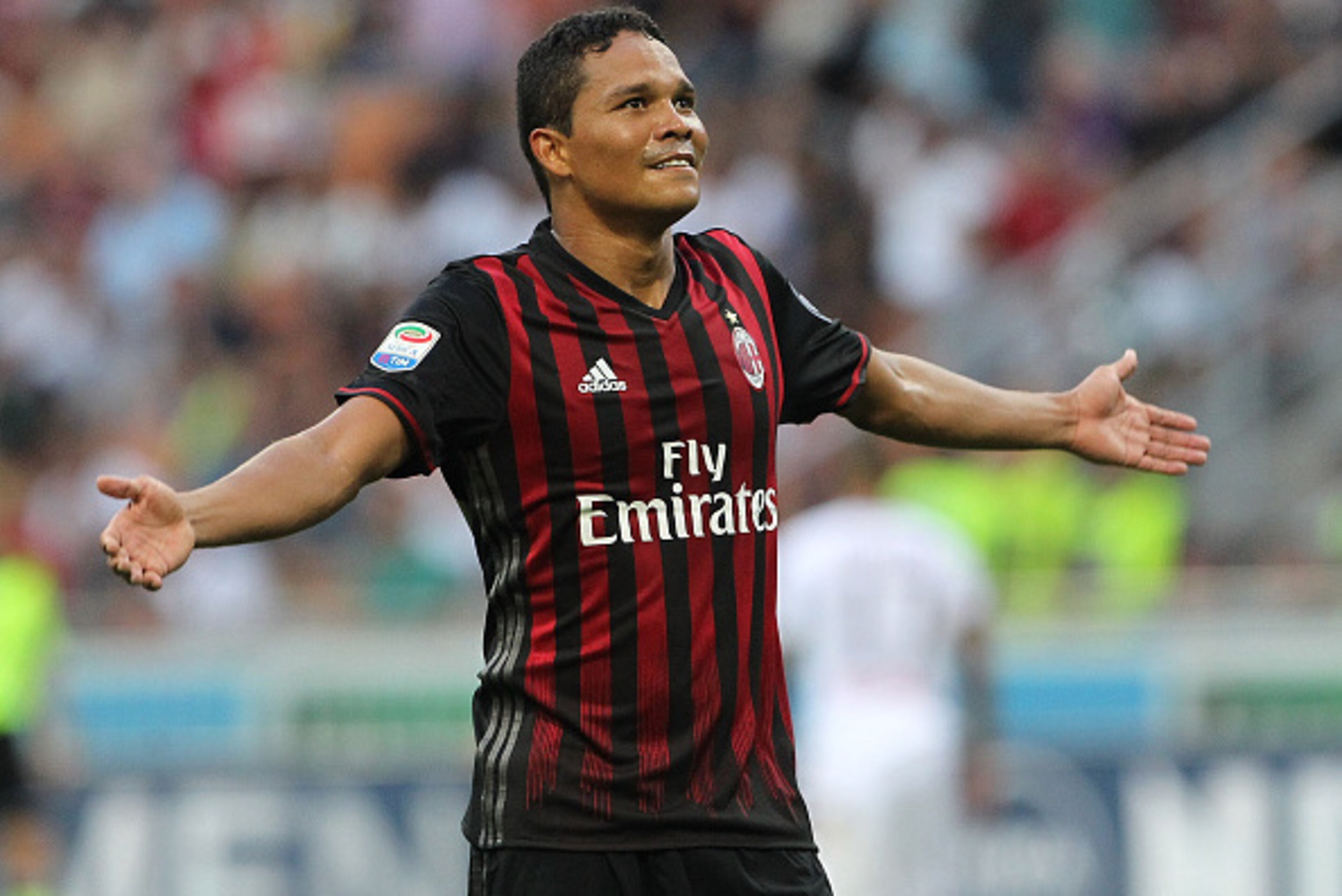 MILAN, ITALY - AUGUST 21:  Carlos Bacca of AC Milan celebrates his third goal during the Serie A match between AC Milan and FC Torino at Stadio Giuseppe Meazza on August 21, 2016 in Milan, Italy.  (Photo by Marco Luzzani/Getty Images)