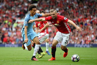MANCHESTER, ENGLAND - SEPTEMBER 10:  Luke Shaw of Manchester United in action with Leroy Sane of  Manchester City during the Premier League match between Manchester United and Manchester City at Old Trafford on September 10, 2016 in Manchester, England.  