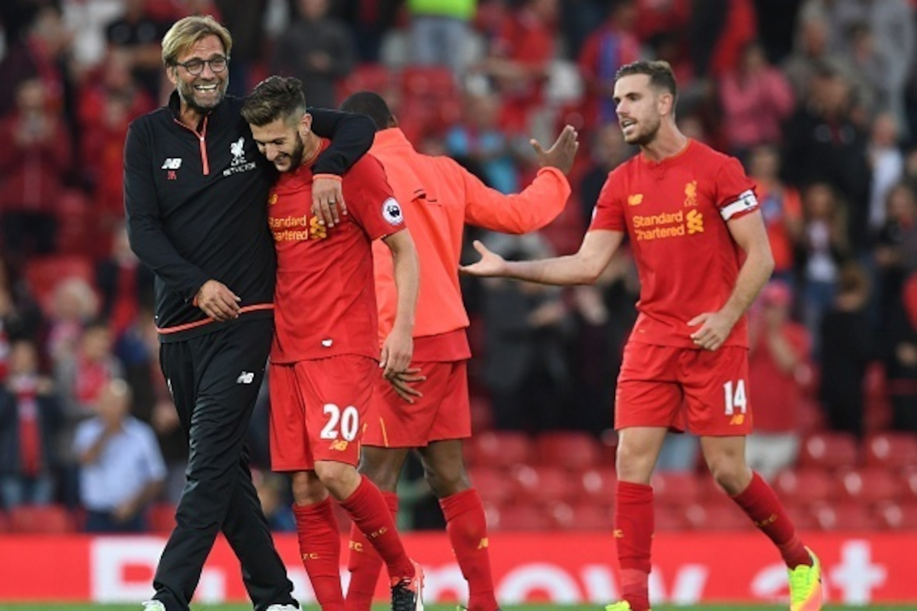 Liverpool's German manager Jurgen Klopp (L) celebrates on the pitch with Liverpool's English midfielder Adam Lallana (2nd L) after the English Premier League football match between Liverpool and Leicester City at Anfield in Liverpool, north west England o Liverpool's German manager Jurgen Klopp (L) celebrates on the pitch with Liverpool's English midfielder Adam Lallana (2nd L) after the English Premier League football match between Liverpool and Leicester City at Anfield in Liverpool, north west England o