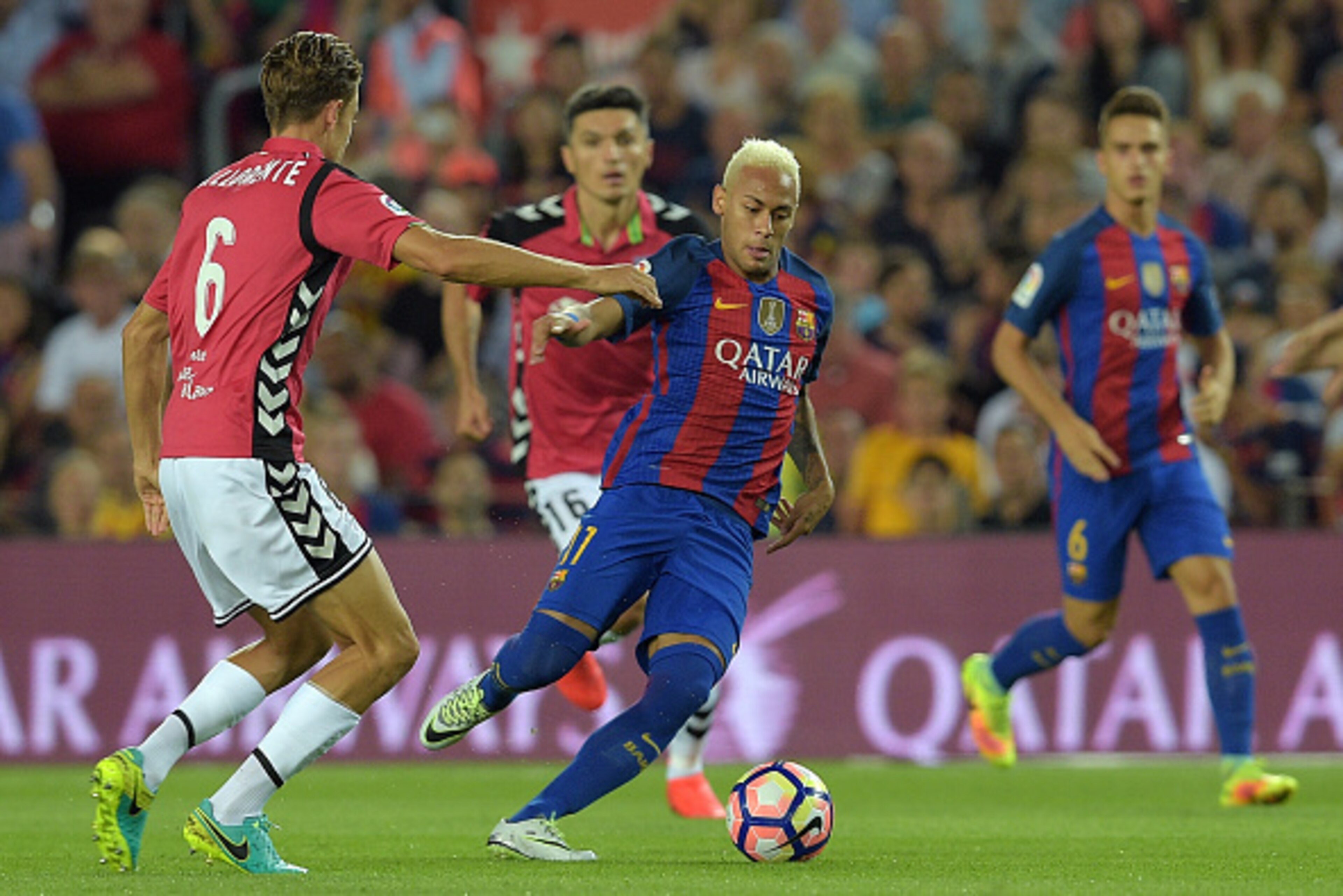 Barcelona's Brazilian forward Neymar (3rd L) vies with Alaves' midfielder Marcos Llorente (L) during the Spanish league football match FC Barcelona vs Deportivo Alaves at the Camp Nou stadium in Barcelona on September 10, 2016. / AFP / LLUIS GENE        (