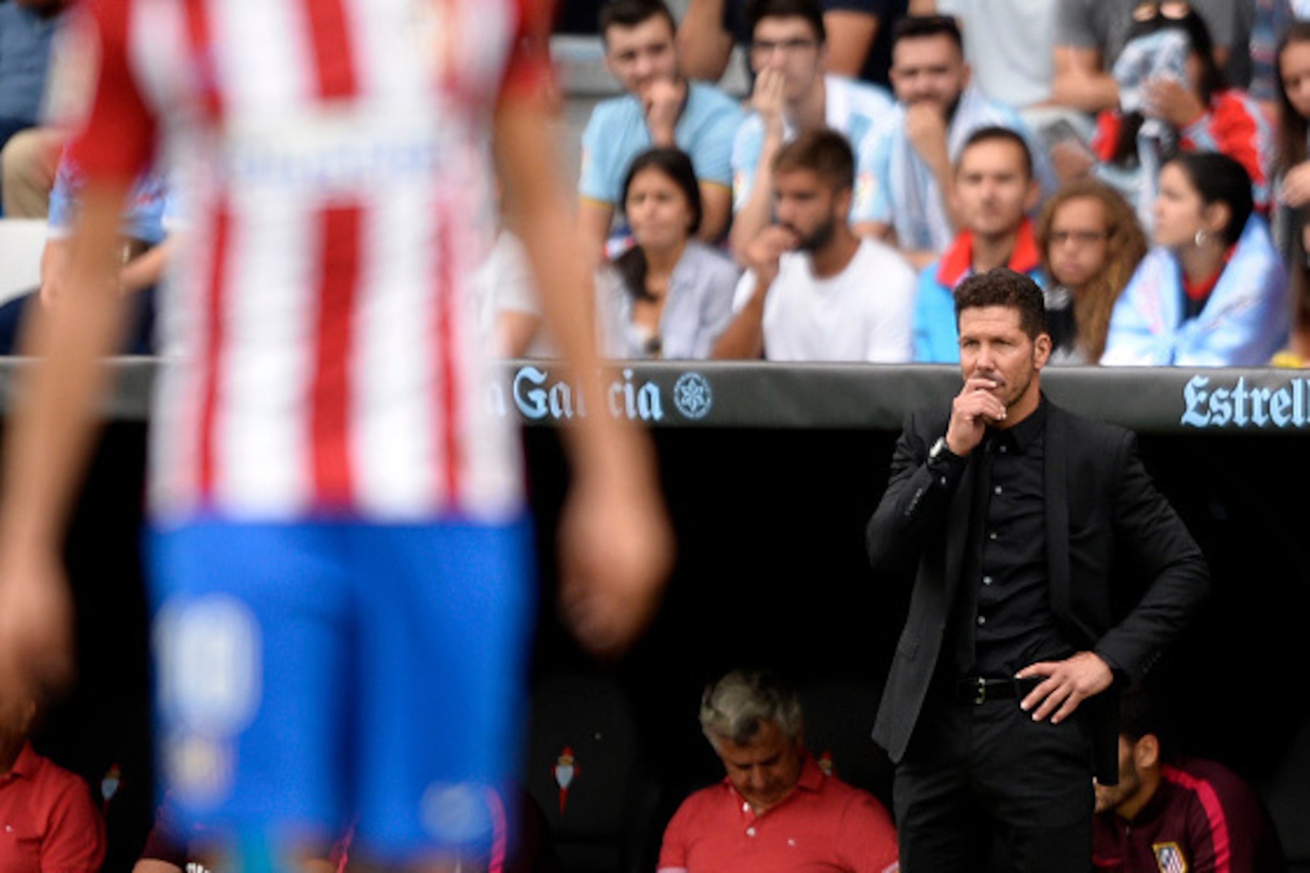 Atletico Madrid's Argentinian coach Diego Simeone stands on the sideline during the Spanish league football match RC Celta de Vigo vs Club Atletico de Madrid at the Balaidos stadium in Vigo on September 10, 2016.
Atletico won 4-0. / AFP / MIGUEL RIOPA    