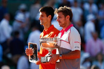 PARIS, FRANCE - JUNE 07:  Stanislas Wawrinka of Switzerland poses with the Coupe de Mousquetaires and runner up Novak Djokovic of Serbia after their Men's Singles Final on day fifteen of the 2015 French Open at Roland Garros on June 7, 2015 in Paris, Fran