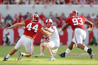 TUSCALOOSA, AL - SEPTEMBER 10:  Tyler Ferguson #7 of the Western Kentucky Hilltoppers prepares to be sacked by Dakota Ball #44 and Jonathan Allen #93 of the Alabama Crimson Tide at Bryant-Denny Stadium on September 10, 2016 in Tuscaloosa, Alabama.  (Photo