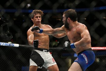 CLEVELAND, OH - SEPTEMBER 10:  Jimmie Rivera punches Urijah Faber during the UFC 203 event at Quicken Loans Arena on September 10, 2016 in Cleveland, Ohio. (Photo by Rey Del Rio/Getty Images)