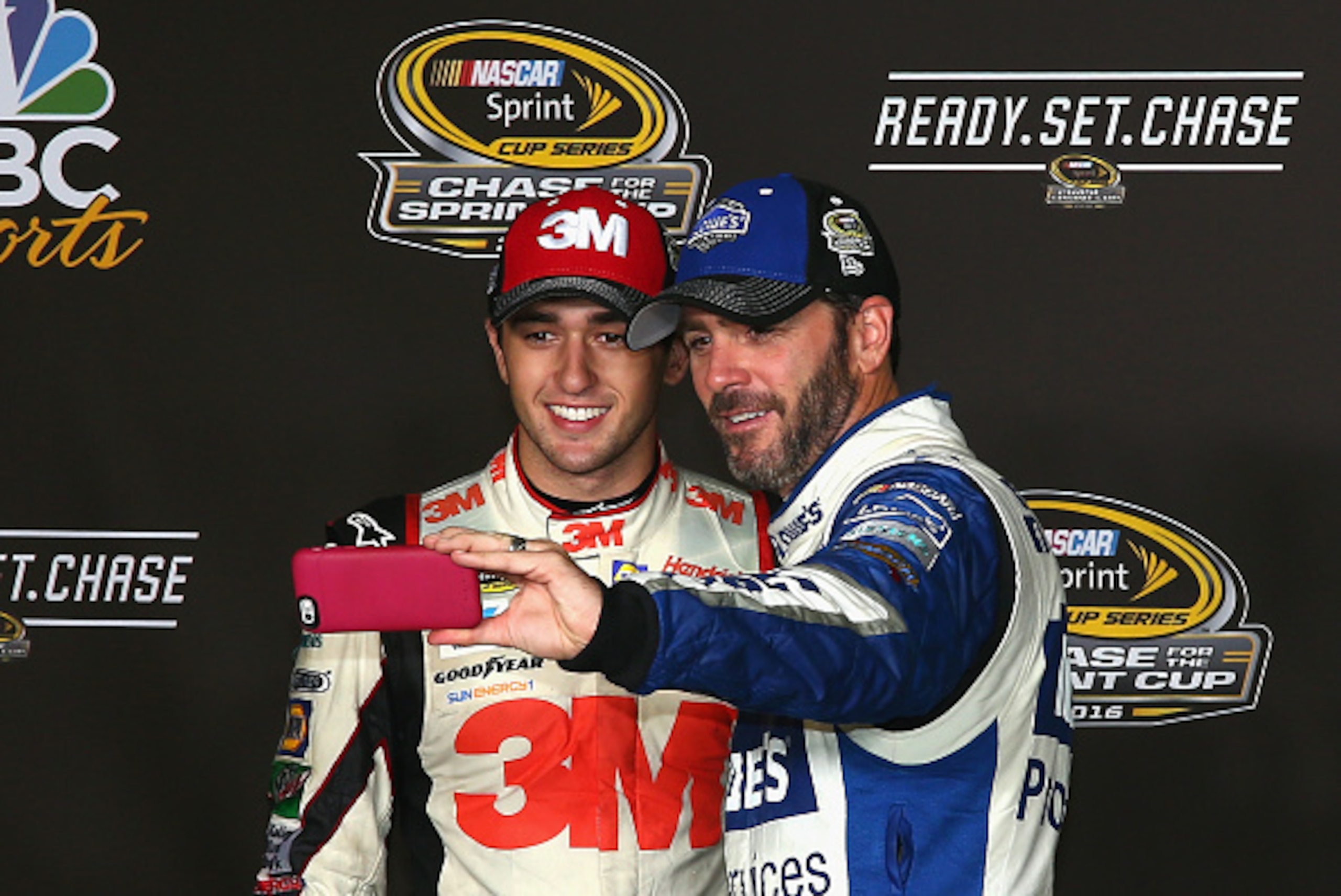 RICHMOND, VA - SEPTEMBER 10:  Jimmie Johnson, driver of the #48 Lowe's Pro Services Chevrolet, and Chase Elliott, driver of the #24 3M/American Red Cross Chevrolet, take a selfie after the NASCAR Sprint Cup Series Federated Auto Parts 400 at Richmond Inte