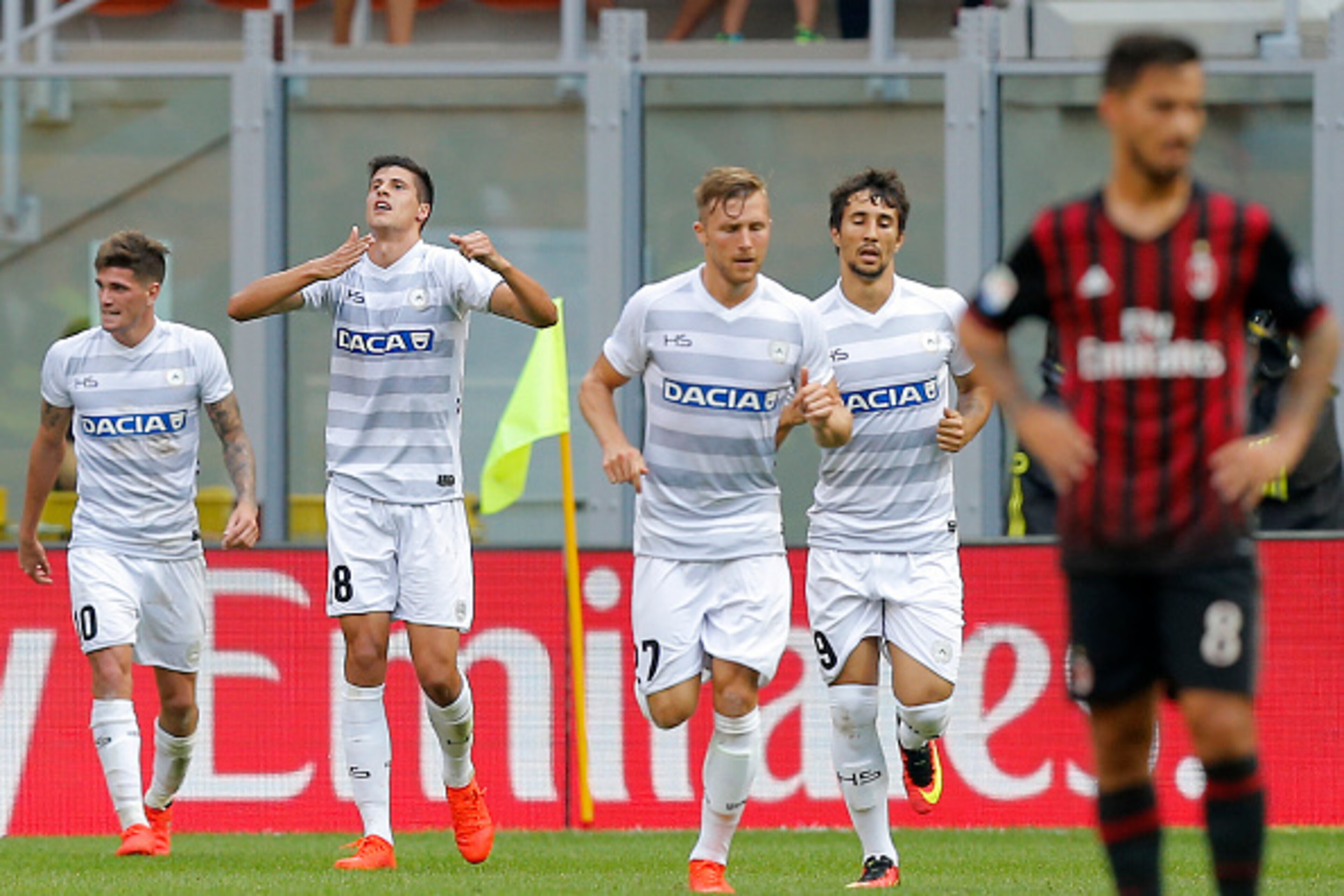 Udinese's forward Stipe Perica from Croatia (2ndL) celebrates after scoring a goal during the Italian Serie A football match AC Milan vs Udinese on September 11, 2016 at 'San Siro Stadium' in Milan.  / AFP / MARCO BERTORELLO        (Photo credit should re