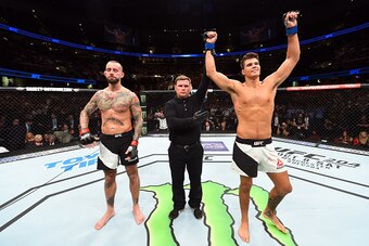 CLEVELAND, OH - SEPTEMBER 10:  (R-L) Mickey Gall celebrates after defeating Phil 'CM Punk' Brooks in their welterweight bout during the UFC 203 event at Quicken Loans Arena on September 10, 2016 in Cleveland, Ohio. (Photo by Josh Hedges/Zuffa LLC/Zuffa LL
