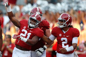 TUSCALOOSA, AL - SEPTEMBER 10:  B.J. Emmons #21 of the Alabama Crimson Tide reacts after scoring a touchdown against the Western Kentucky Hilltoppers with Jalen Hurts #2 at Bryant-Denny Stadium on September 10, 2016 in Tuscaloosa, Alabama.  (Photo by Kevi