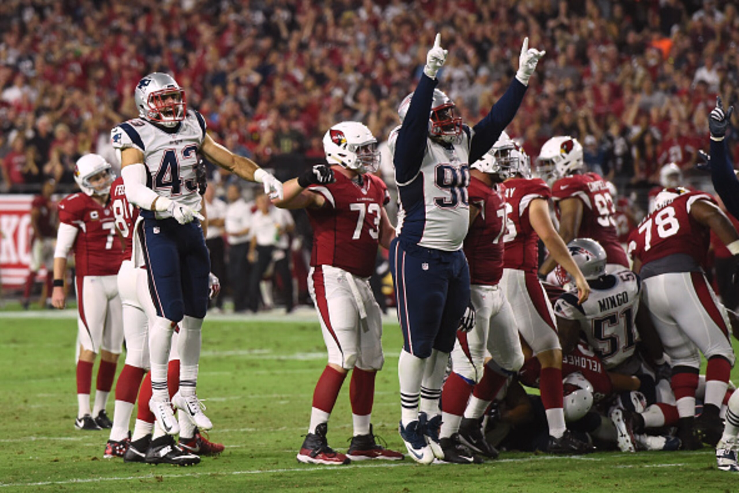 GLENDALE, AZ - SEPTEMBER 11:  Defensive back Nate Ebner #43 and defensive tackle Malcom Brown #90 of the New England Patriots celebrate after kicker Chandler Catanzaro #7 of the Arizona Cardinals misses a field goal in the last seconds of the fourth quart