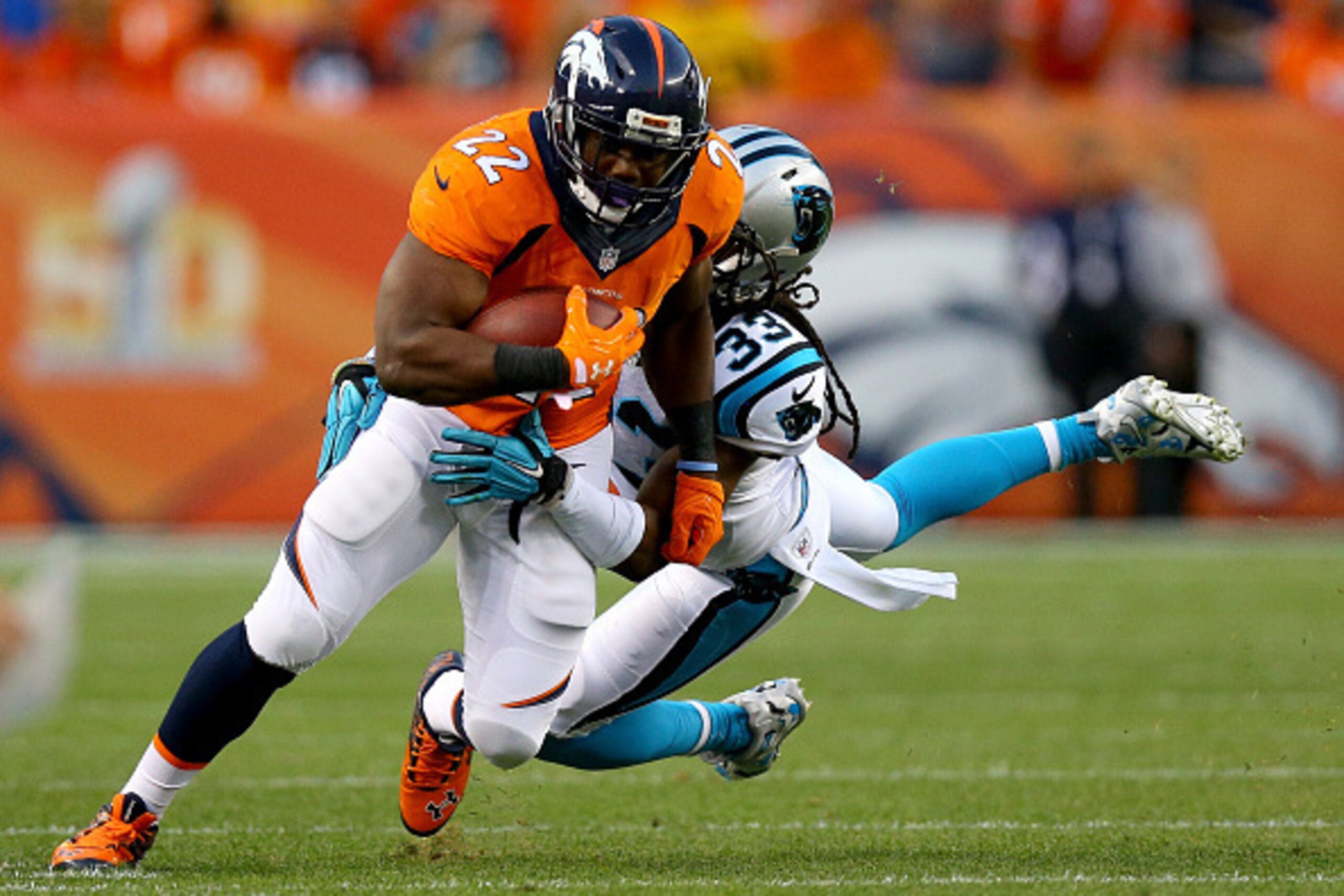 DENVER, CO - SEPTEMBER 08: Running back C.J. Anderson #22 of the Denver Broncos runs the ball against free safety Tre Boston #33 of the Carolina Panthers in the first half at Sports Authority Field at Mile High on September 8, 2016 in Denver, Colorado. DENVER, CO - SEPTEMBER 08: Running back C.J. Anderson #22 of the Denver Broncos runs the ball against free safety Tre Boston #33 of the Carolina Panthers in the first half at Sports Authority Field at Mile High on September 8, 2016 in Denver, Colorado.