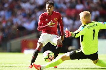 LONDON, ENGLAND - AUGUST 07: Jesse Lingard of Manchester United scores his sides first goal past Kasper Schmeichel of Leicester City during The FA Community Shield match between Leicester City and Manchester United at Wembley Stadium on August 7, 2016 in 