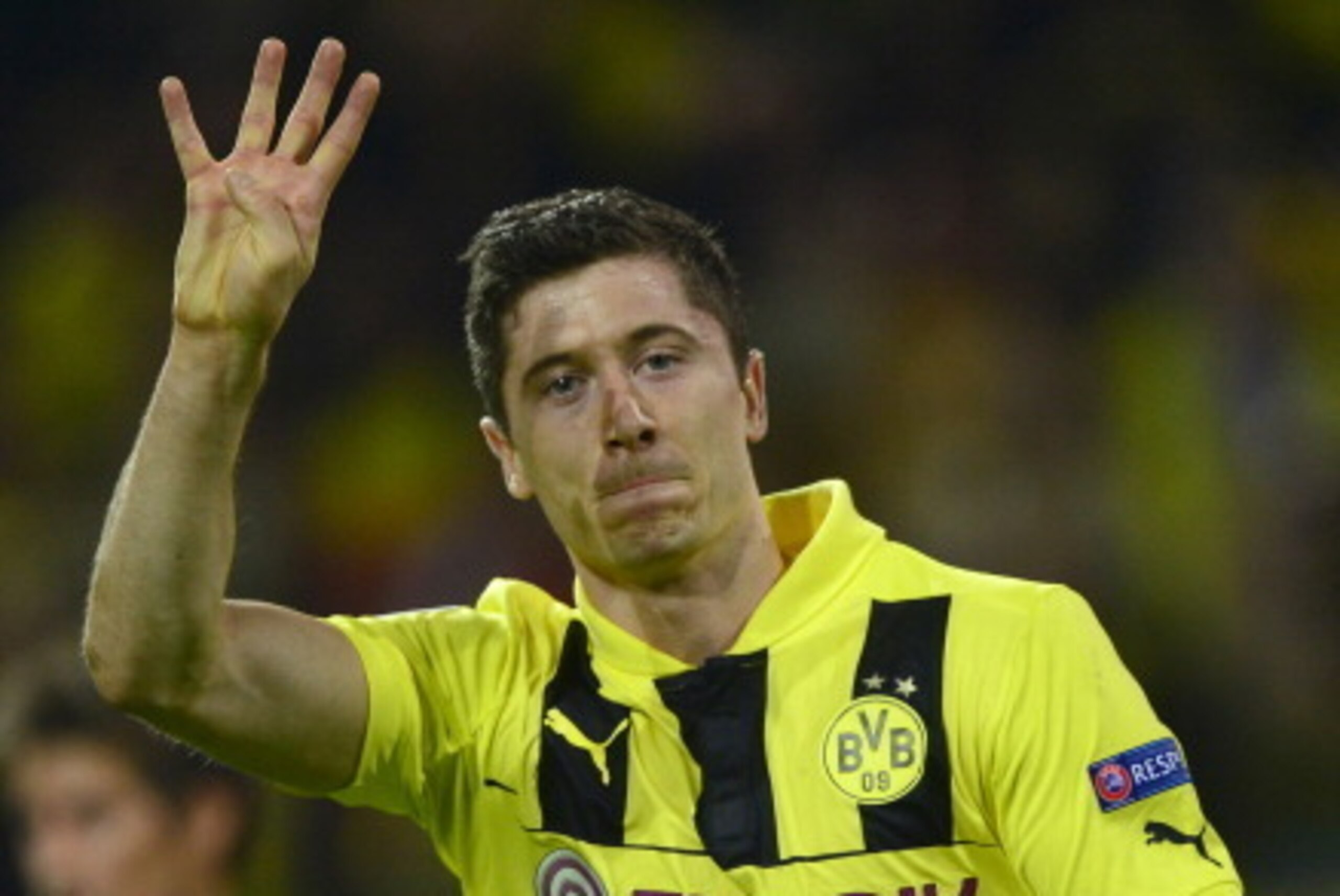 (FILES) - Picture taken on April 24, 2013 shows Dortmund's Polish striker Robert Lewandowski celebrating after scoring a penalty to mark the 4-1 during the UEFA Champions League semi final first leg football match between Borussia Dortmund and Real Madrid (FILES) - Picture taken on April 24, 2013 shows Dortmund's Polish striker Robert Lewandowski celebrating after scoring a penalty to mark the 4-1 during the UEFA Champions League semi final first leg football match between Borussia Dortmund and Real Madrid