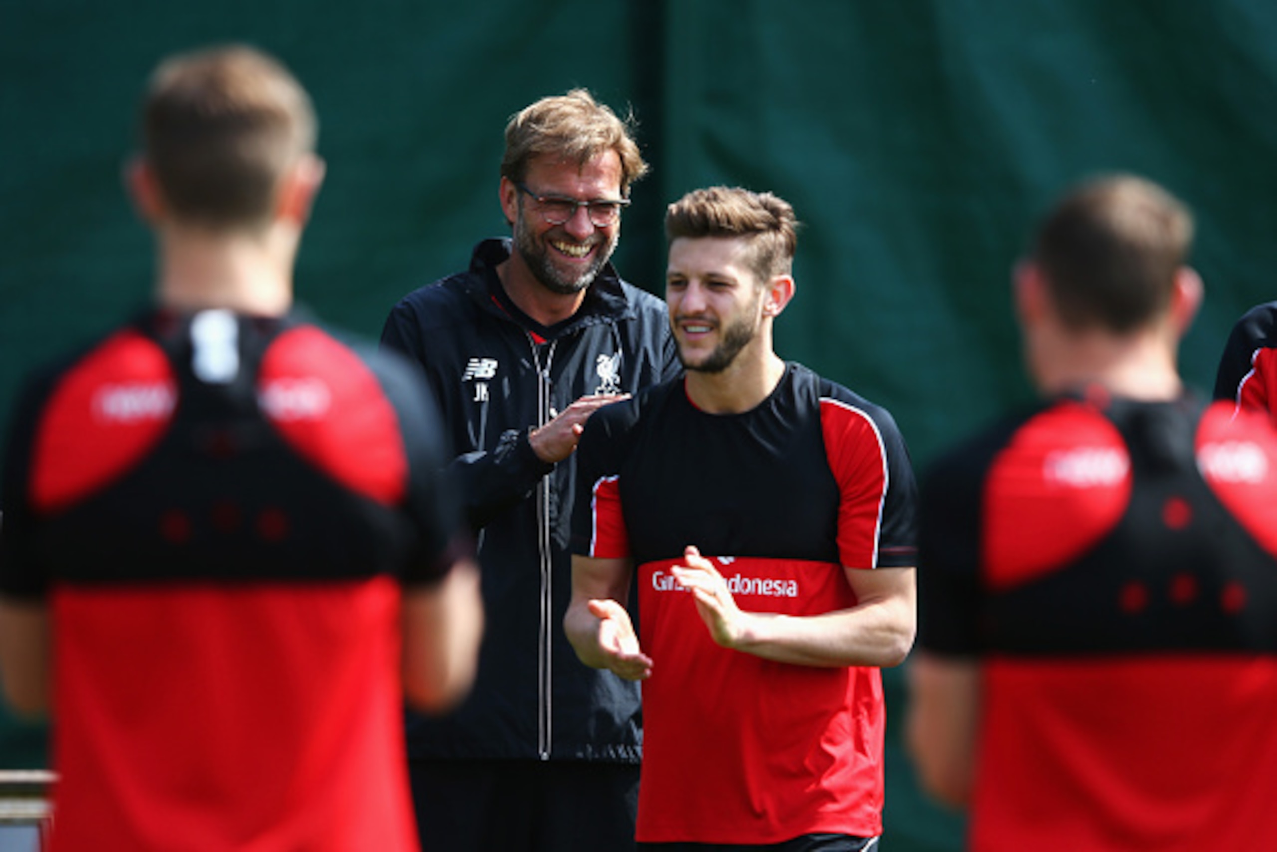 LIVERPOOL, ENGLAND - MAY 13: Jurgen Klopp, manager of Liverpool laughs with Adam Lallana during a training session at the Liverpool UEFA Europa League Cup Final Media Day at Melwood Training Ground on May 13, 2016 in Liverpool, England. (Photo by Alex L LIVERPOOL, ENGLAND - MAY 13: Jurgen Klopp, manager of Liverpool laughs with Adam Lallana during a training session at the Liverpool UEFA Europa League Cup Final Media Day at Melwood Training Ground on May 13, 2016 in Liverpool, England. (Photo by Alex L