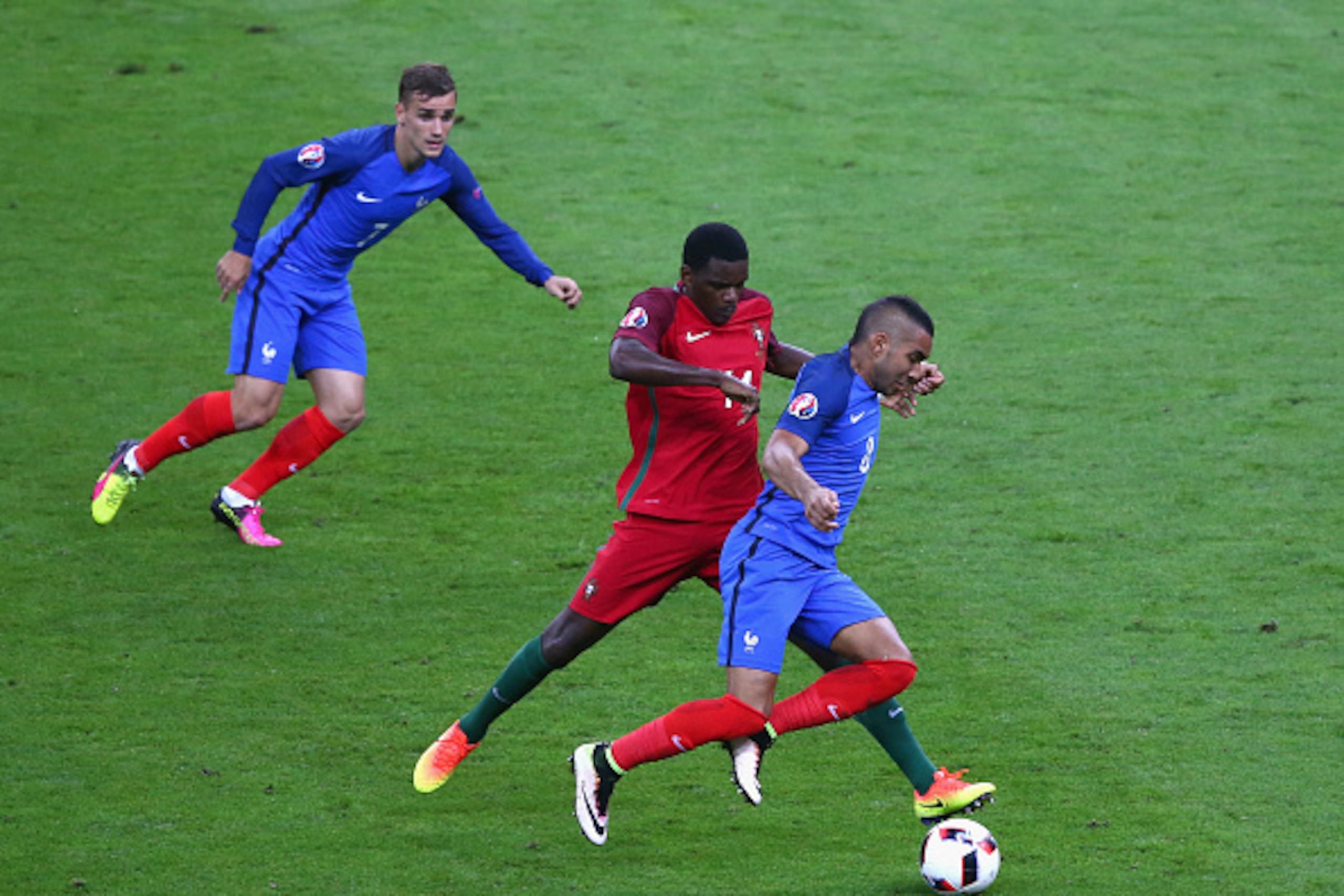 PARIS, FRANCE - JULY 10:  William Carvalho of Portugal tackled Dimitri Payet of France during the UEFA EURO 2016 Final match between Portugal and France at Stade de France on July 10, 2016 in Paris, France.  (Photo by Alex Livesey/Getty Images)