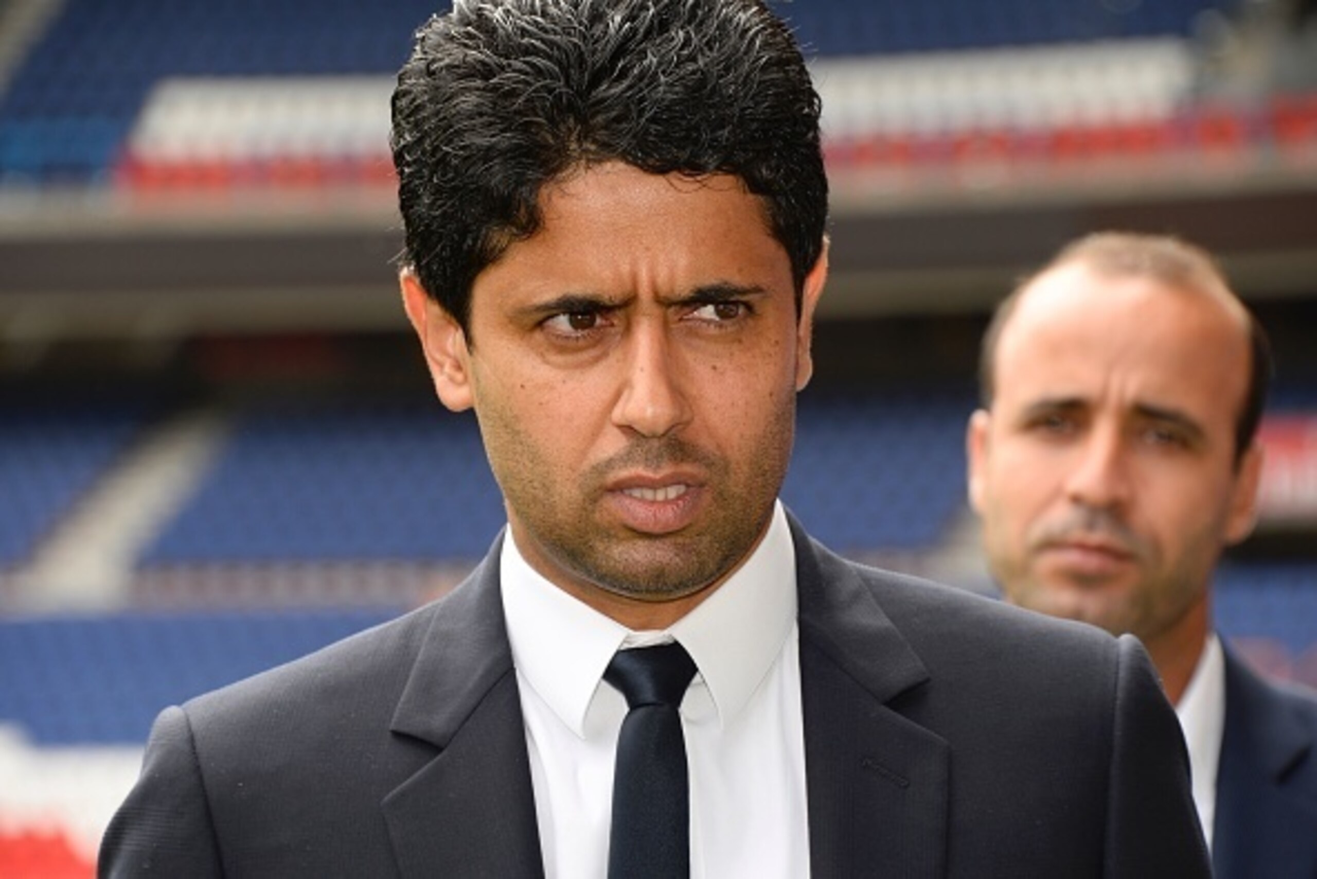Paris Saint-Germain's Qatari president Nasser Al-Khelaifi (L) looks on during a press conference at the Parc des Princes stadium in Paris on August 8, 2016. / AFP / BERTRAND GUAY        (Photo credit should read BERTRAND GUAY/AFP/Getty Images)