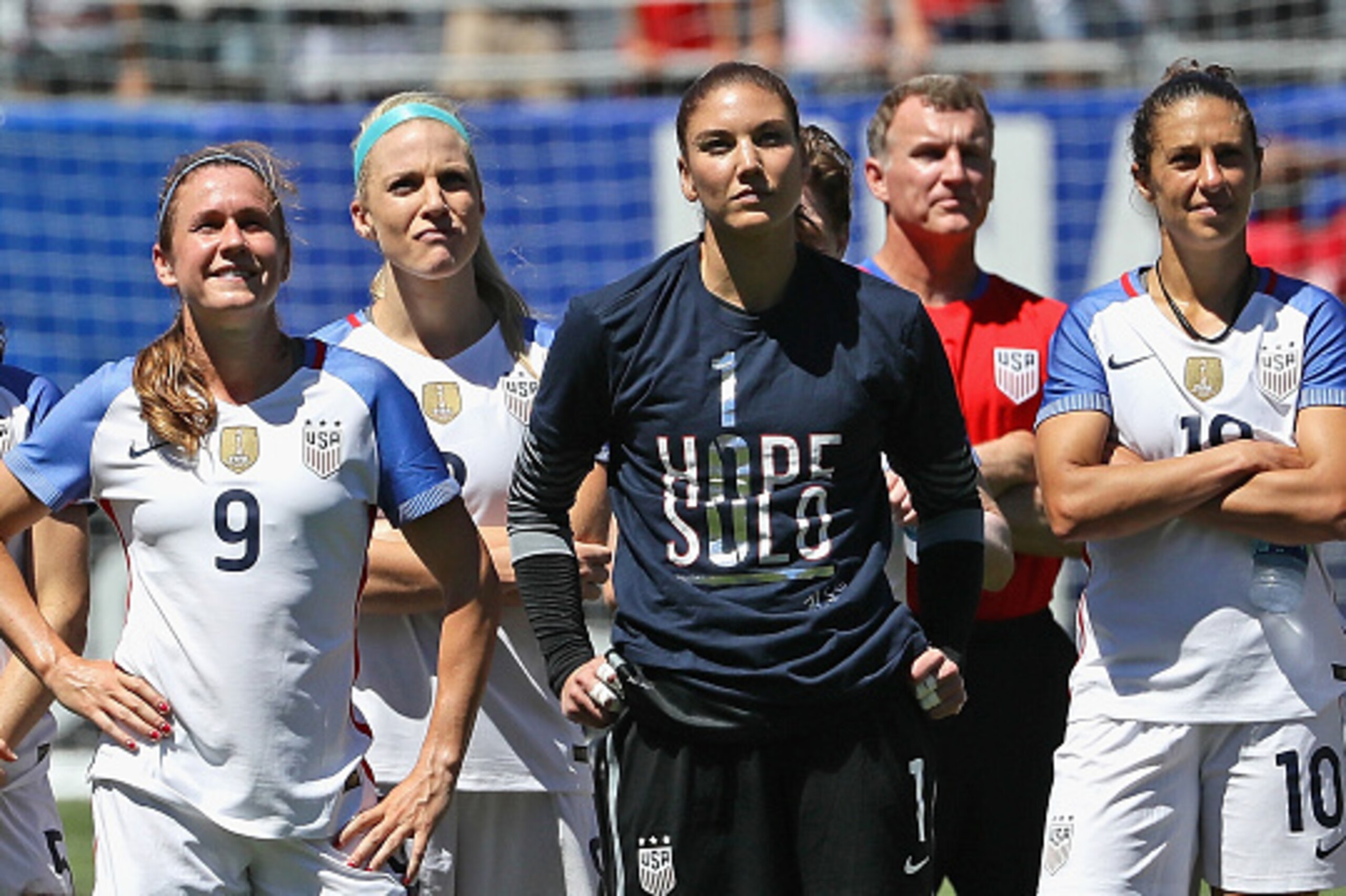 CHICAGO, IL - JULY 09: (L-R) Heather O'Reilly #9, Julie Johnson #8, Hope Solo #1 and Carli Lloyd #10 of the United States watch a video tribute to Solo after she posted her 100th career shut-out against South Africa in a friendly match at Soldier Field on CHICAGO, IL - JULY 09: (L-R) Heather O'Reilly #9, Julie Johnson #8, Hope Solo #1 and Carli Lloyd #10 of the United States watch a video tribute to Solo after she posted her 100th career shut-out against South Africa in a friendly match at Soldier Field on