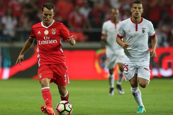 AVEIRO, PORTUGAL - AUGUST 7: SL Benfica's defender from Spain Alex Grimaldo (L) with SC Braga's Portuguese midfielder Pedro Tiba (R) in action during the Super Cup match between SL Benfica and SC Braga at Estadio Municipal de Aveiro on August 7, 2016 in A