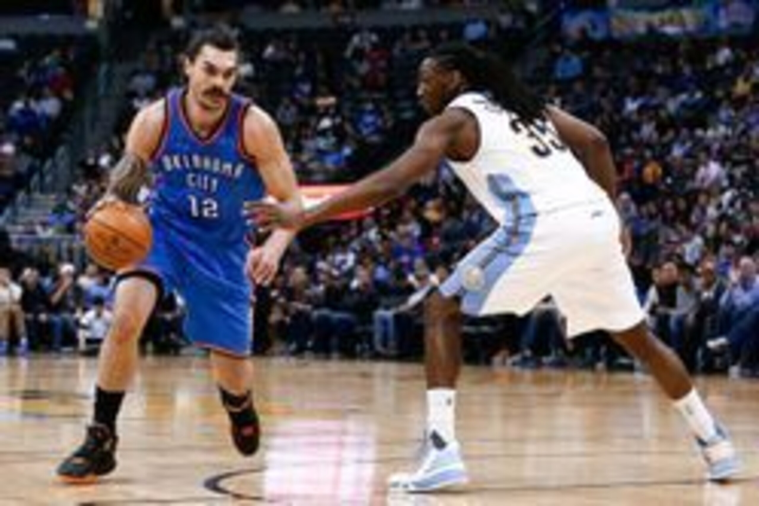 Apr 5, 2016; Denver, CO, USA; Denver Nuggets forward Kenneth Faried (35) guards Oklahoma City Thunder center Steven Adams (12) in the third quarter at the Pepsi Center. The Thunder defeated the Nuggets 124-102. Mandatory Credit: Isaiah J. Downing-USA TODA