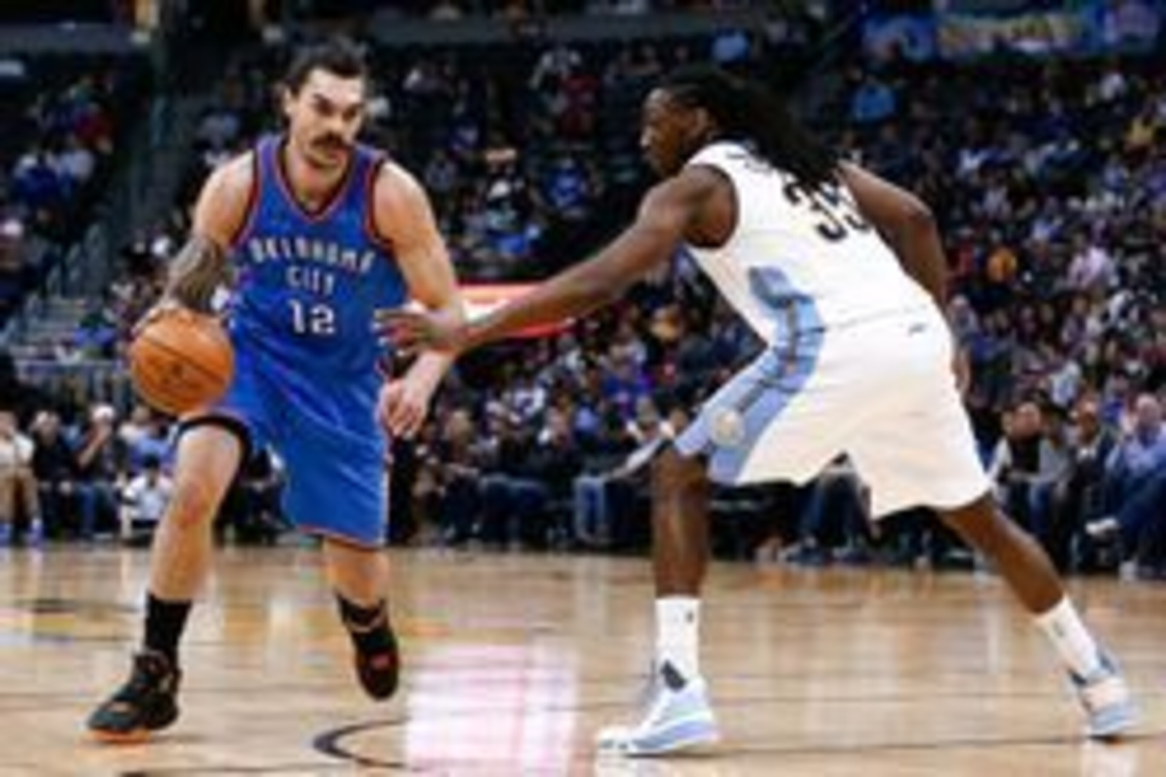 Apr 5, 2016; Denver, CO, USA; Denver Nuggets forward Kenneth Faried (35) guards Oklahoma City Thunder center Steven Adams (12) in the third quarter at the Pepsi Center. The Thunder defeated the Nuggets 124-102. Mandatory Credit: Isaiah J. Downing-USA TODA