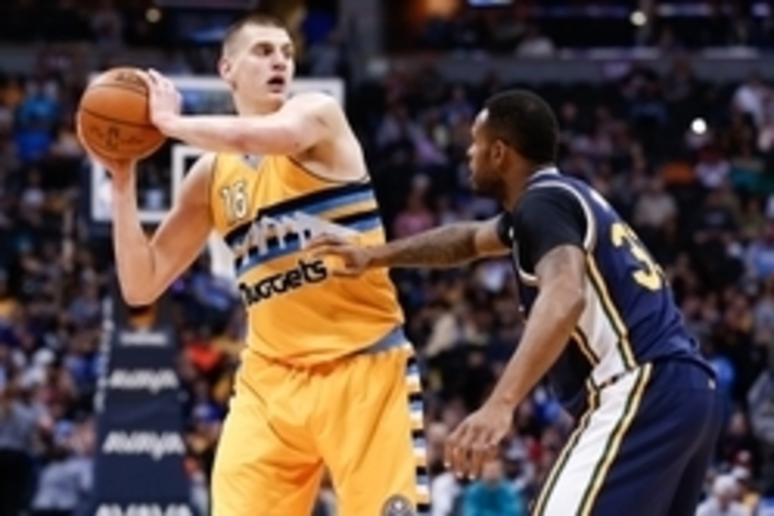 Apr 10, 2016; Denver, CO, USA; Utah Jazz forward Trevor Booker (33) guards Denver Nuggets center Nikola Jokic (15) in the third quarter at the Pepsi Center. The Jazz defeated the Nuggets 100-84. Mandatory Credit: Isaiah J. Downing-USA TODAY Sports