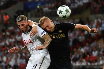 Tottenham Hotspur's Belgian defender Toby Alderweireld (L) scores past Monaco's Polish defender Kamil Glik during the UEFA Champions League group E football match between Tottenham Hotspur and Monaco at Wembley Stadium in north London on September 14, 201