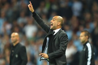 MANCHESTER, ENGLAND - SEPTEMBER 14: Josep Guardiola manager of Manchester City issues instructions to his players during the UEFA Champions League match between Manchester City FC and VfL Borussia Moenchengladbach at Etihad Stadium on September 14, 2016 i