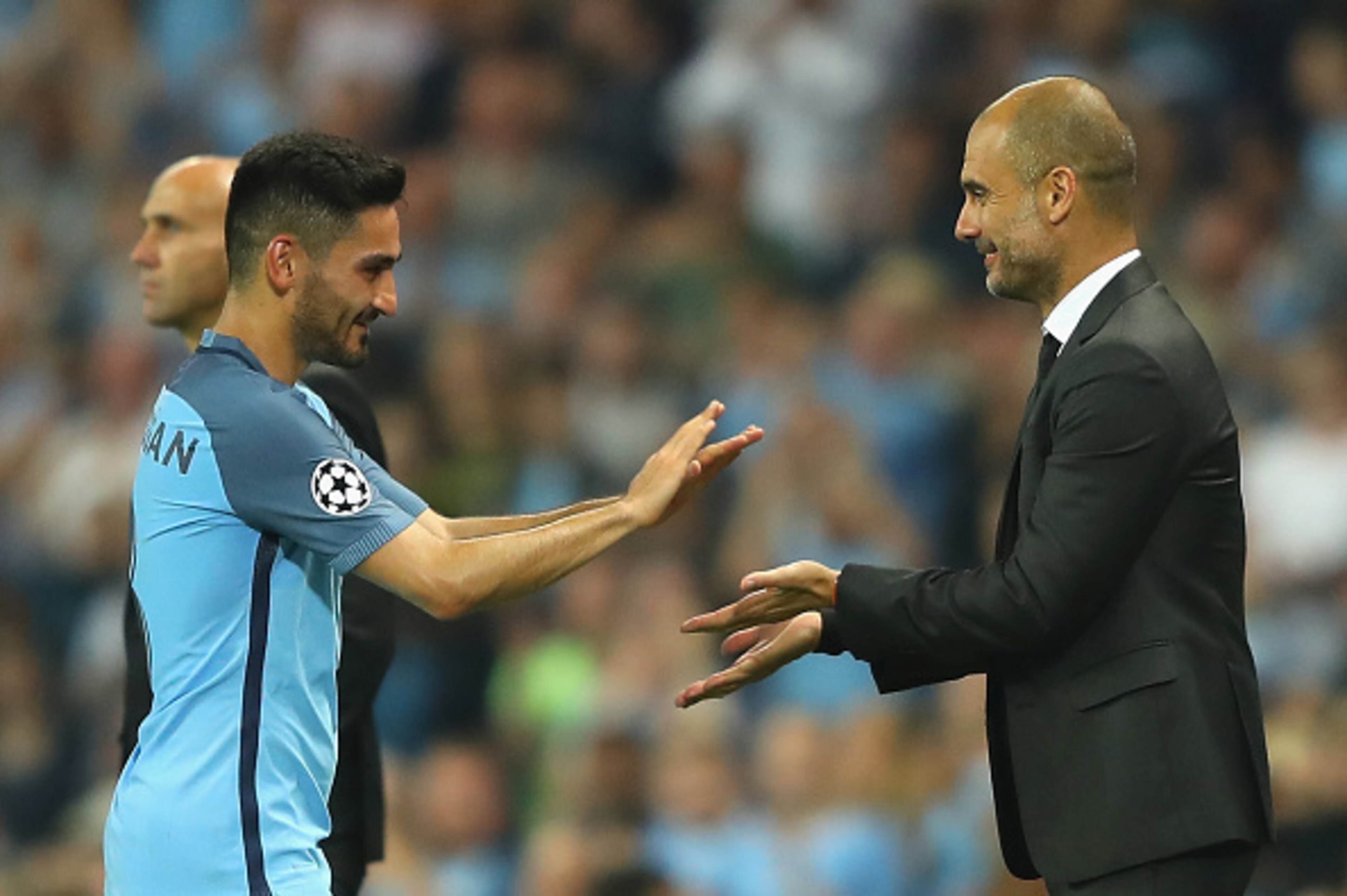 MANCHESTER, ENGLAND - SEPTEMBER 14: Josep Guardiola manager of Manchester City congratulates Ilkay Gundogan during the UEFA Champions League match between Manchester City FC and VfL Borussia Moenchengladbach at Etihad Stadium on September 14, 2016 in Manc