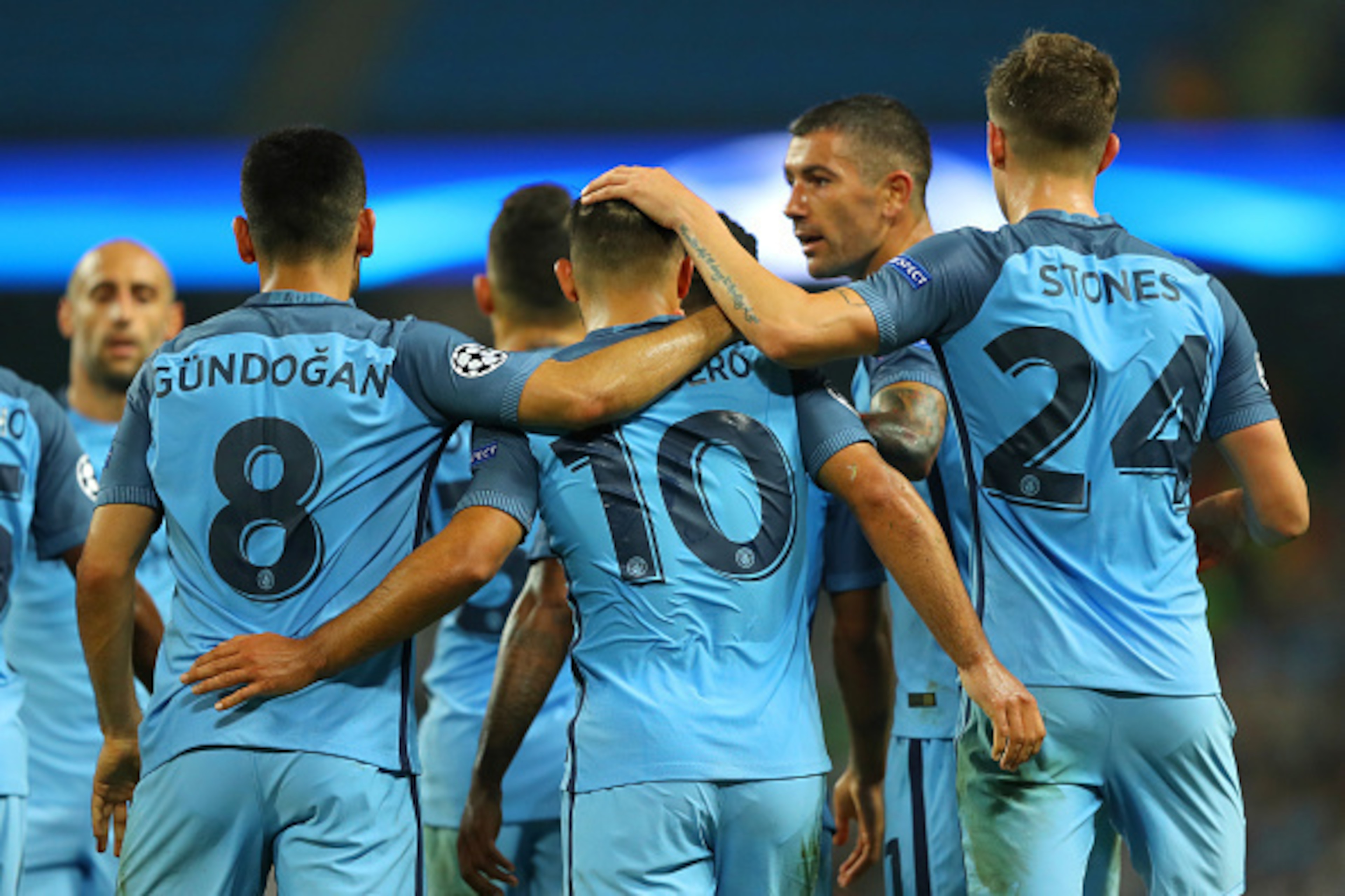 MANCHESTER, ENGLAND - SEPTEMBER 14: Manchester City players celebrate with goalscorer Sergio Aguero during the UEFA Champions League match between Manchester City FC and VfL Borussia Moenchengladbach at Etihad Stadium on September 14, 2016 in Manchester, 