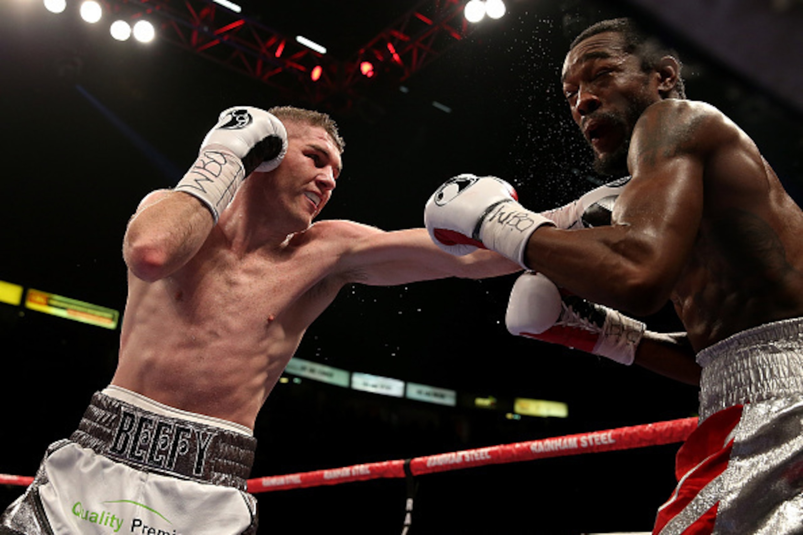 MANCHESTER, ENGLAND - OCTOBER 10:  Liam Smith of Great Britain and John Thompson of The USA exchange blows during their WBO World Super Welterweight championship bout at Manchester Arena on October 10, 2015 in Manchester, England.  (Photo by Ben Hoskins/G