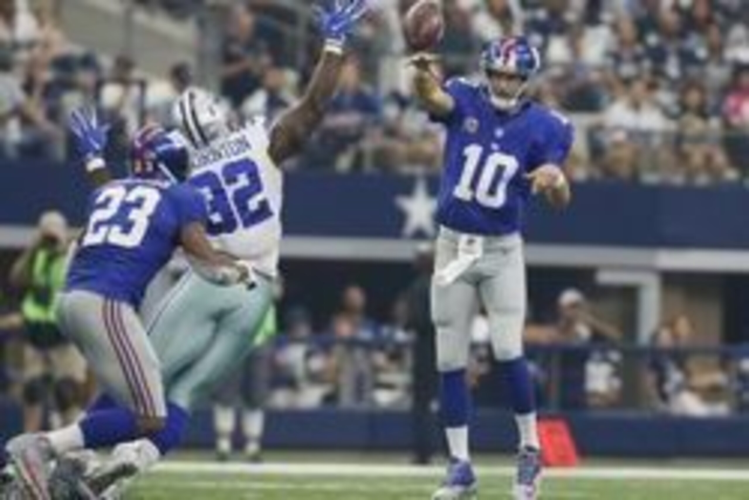 Sep 11, 2016; Arlington, TX, USA; New York Giants quarterback Eli Manning (10) throws a pass attempt to running back Rashad Jennings (23) while Dallas Cowboys defensive tackle Cedric Thornton (92) defends in the second quarter at AT&T Stadium. Mandatory C
