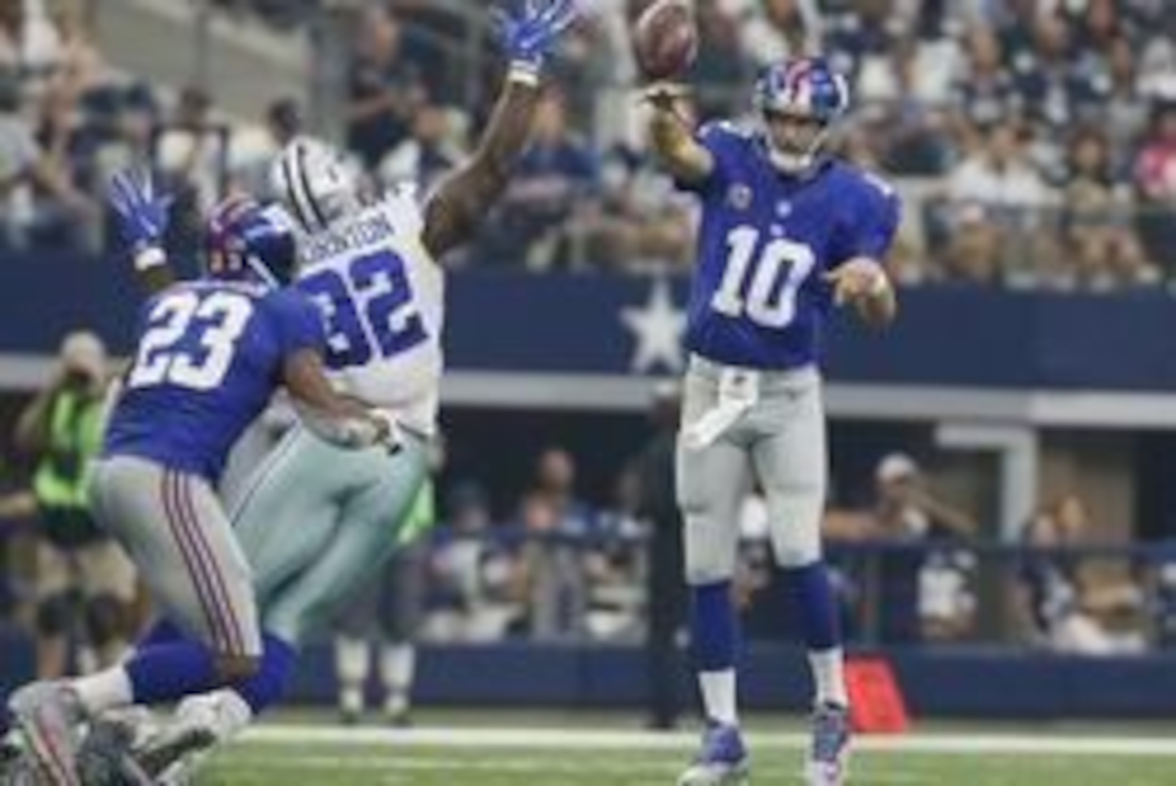 Sep 11, 2016; Arlington, TX, USA; New York Giants quarterback Eli Manning (10) throws a pass attempt to running back Rashad Jennings (23) while Dallas Cowboys defensive tackle Cedric Thornton (92) defends in the second quarter at AT&T Stadium. Mandatory C