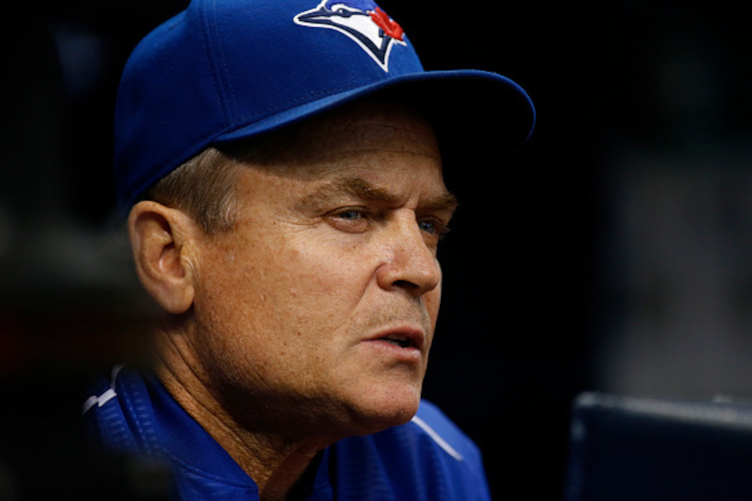 ST. PETERSBURG, FL - SEPTEMBER 3:  Manager John Gibbons #5 of the Toronto Blue Jays looks on from the dugout during the first inning of a game against the Tampa Bay Rays on September 3, 2016 at Tropicana Field in St. Petersburg, Florida. (Photo by Brian B