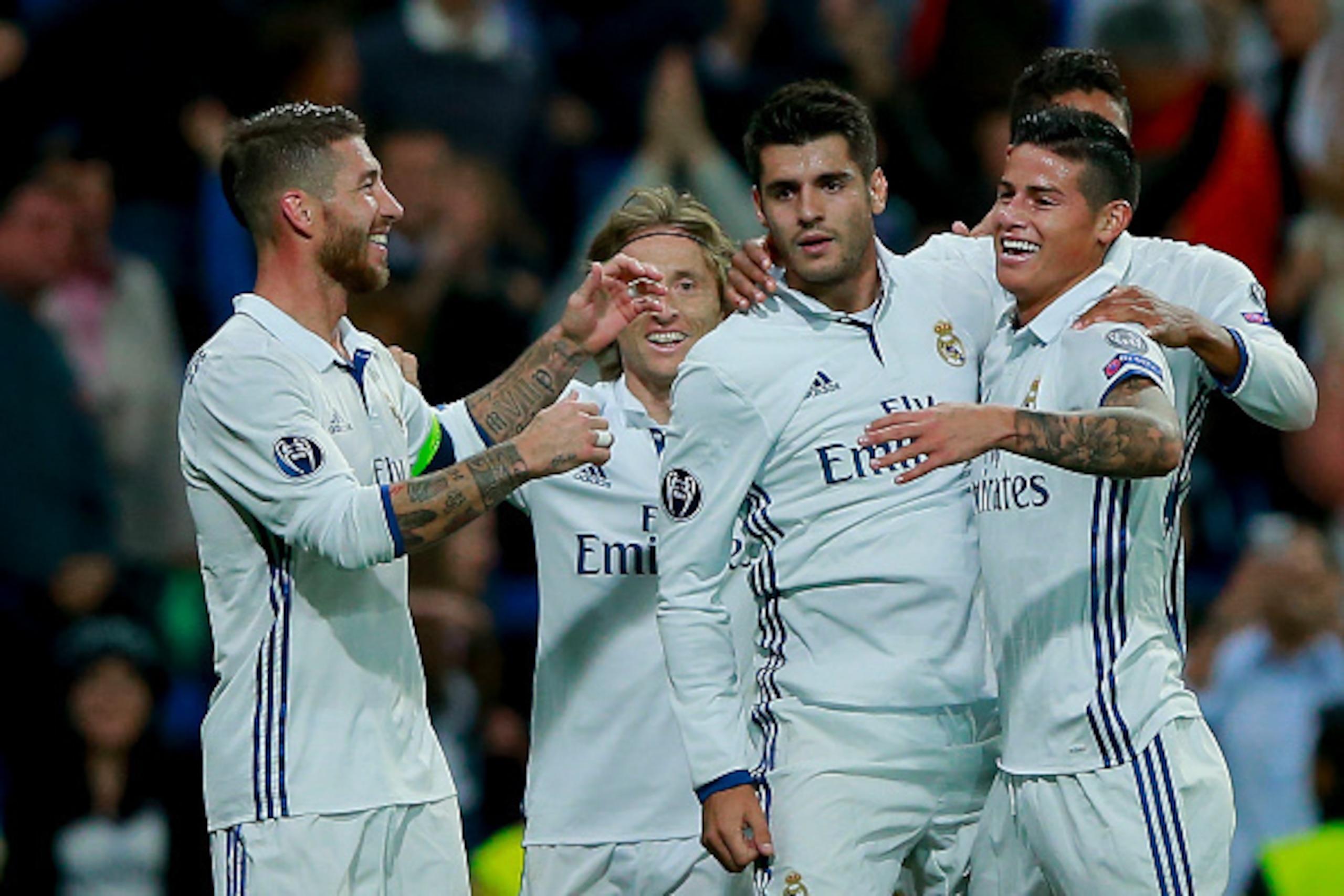 MADRID, SPAIN - SEPTEMBER 14: Alvaro Morata (3dL) of Real Madrid CF celebrates scoring their second goal with teammates James Rodriguez (2ndR), Luka Modric (2ndL) and Sergio Ramos (L) during the UEFA Champions League group stage match between Real Madrid 