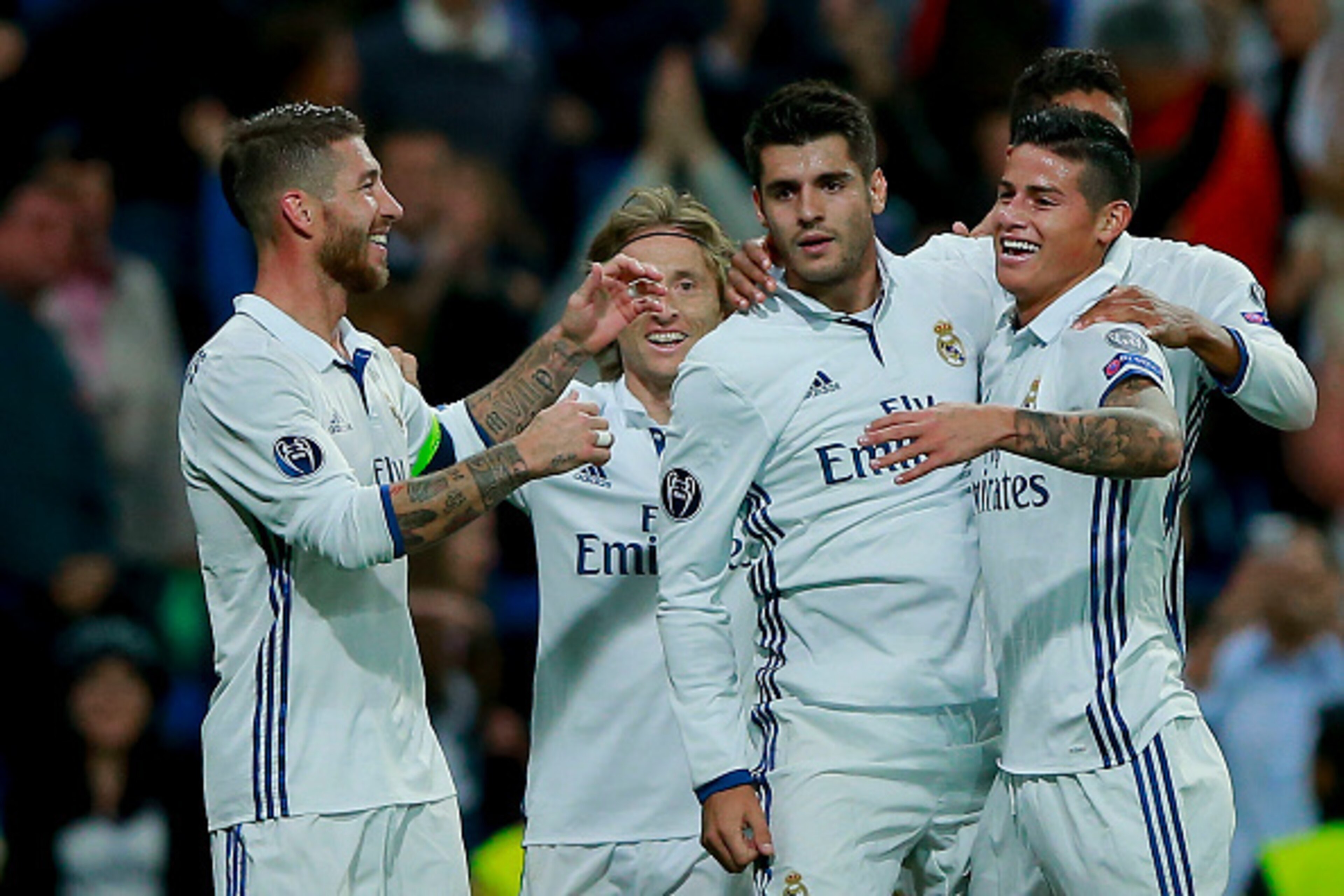 MADRID, SPAIN - SEPTEMBER 14: Alvaro Morata (3dL) of Real Madrid CF celebrates scoring their second goal with teammates James Rodriguez (2ndR), Luka Modric (2ndL) and Sergio Ramos (L) during the UEFA Champions League group stage match between Real Madrid 